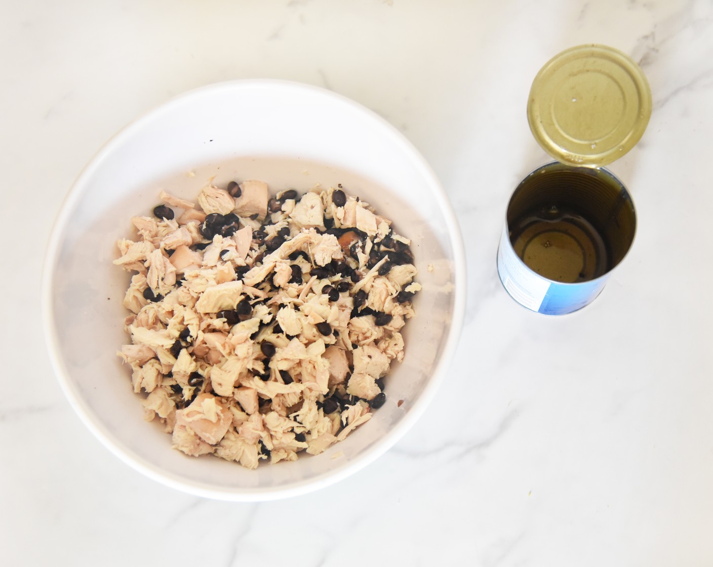 step 4 In a medium bowl combine the Rotisserie Chicken (1) and Black Beans (1 can) until well mixed.