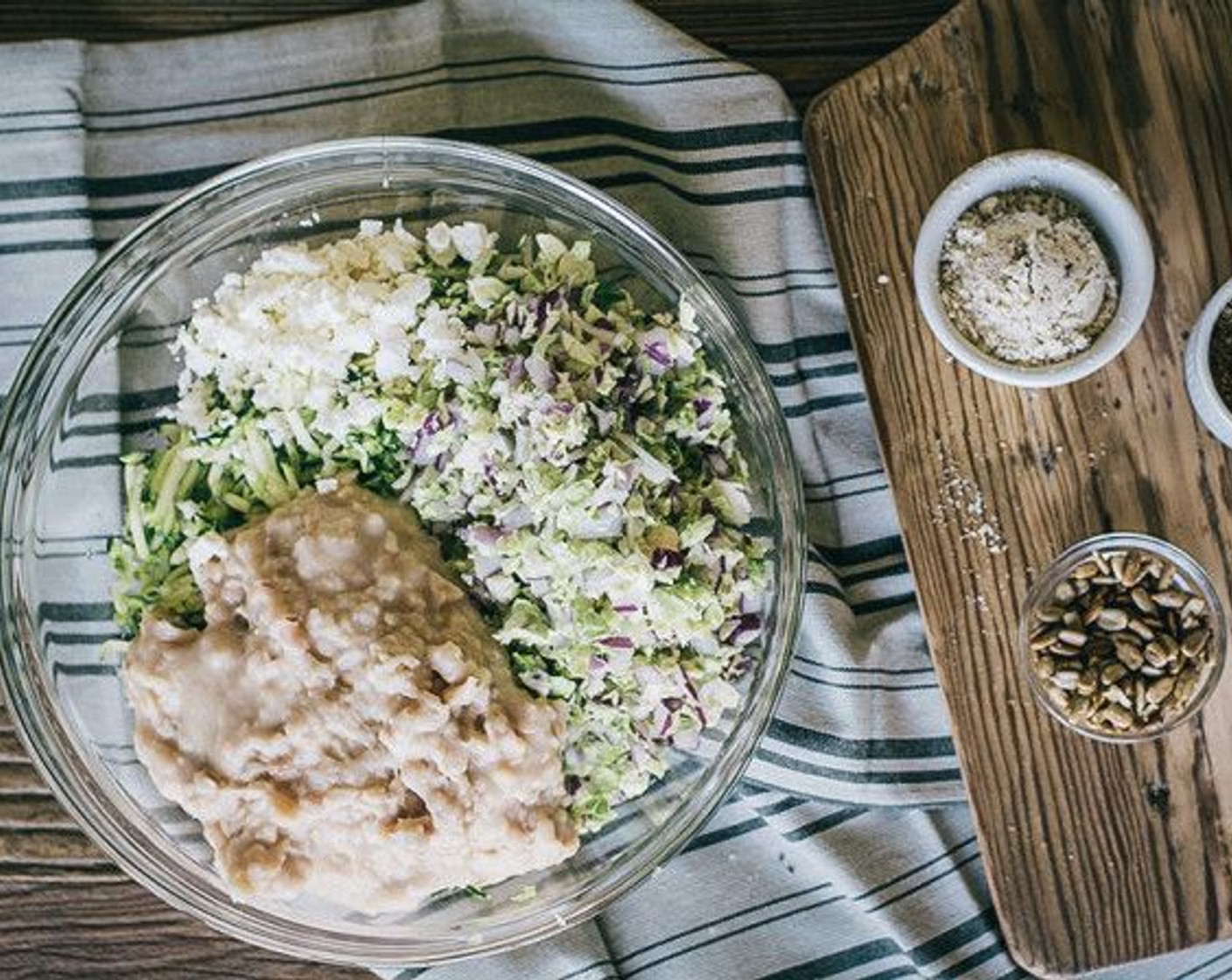 step 6 Add red onion and brussels sprouts to drained zucchini in large bowl, then beans, Feta Cheese (3 Tbsp), Flaxseed Meal (2 Tbsp), Chia Seeds (2 Tbsp), Almond Meal (2 Tbsp), Sunflower Kernels (2 Tbsp).