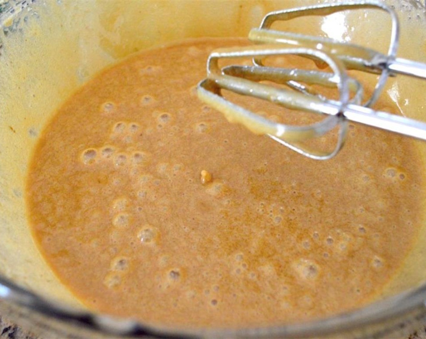 step 4 Combine Granulated Sugar (1 cup), Dark Brown Sugar (1 cup),  Canola Oil (1 cup), Eggland's Best Classic Eggs (3), and Vanilla Extract (1 Tbsp) in a large mixing bowl. Use a hand mixer to whip it all together thoroughly until creamy and fluffy.