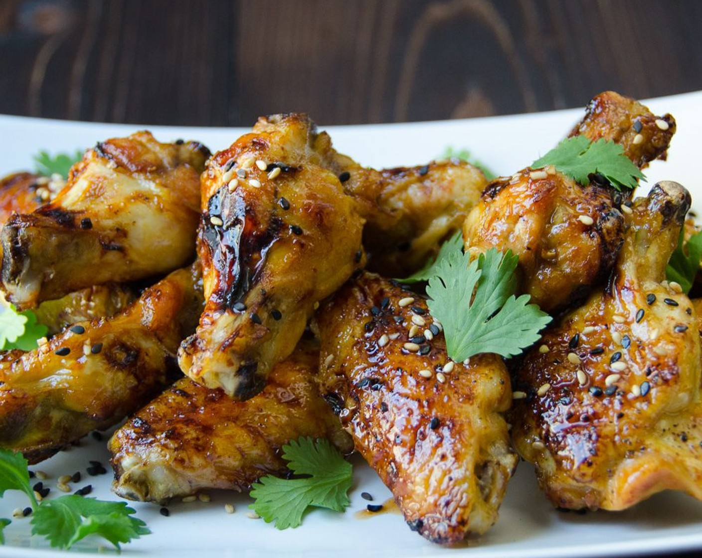 step 9 Transfer wings to a serving platter. Sprinkle with Black Sesame Seeds (1 tsp) or Toasted White Sesame Seeds (1 tsp) and Fresh Cilantro (to taste). Serve with reserved marinade for dipping or drizzling over the wings.