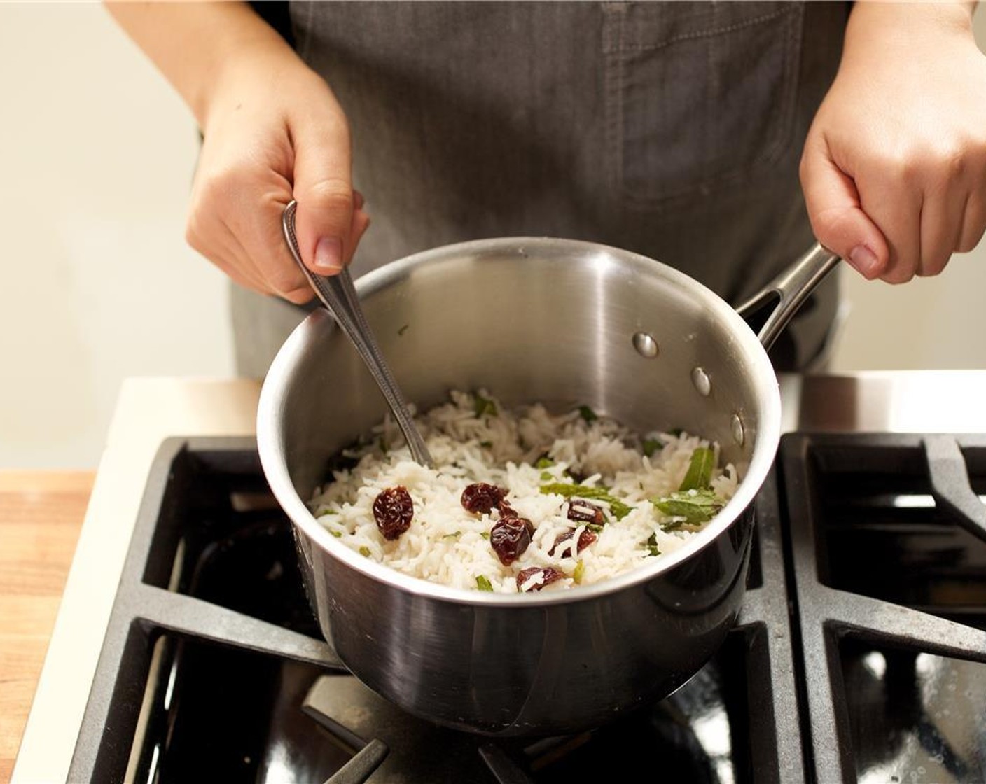 step 11 Remove from heat and add the Dried Cherry (1/4 cup) and fresh mint. Fluff and set aside for plating.