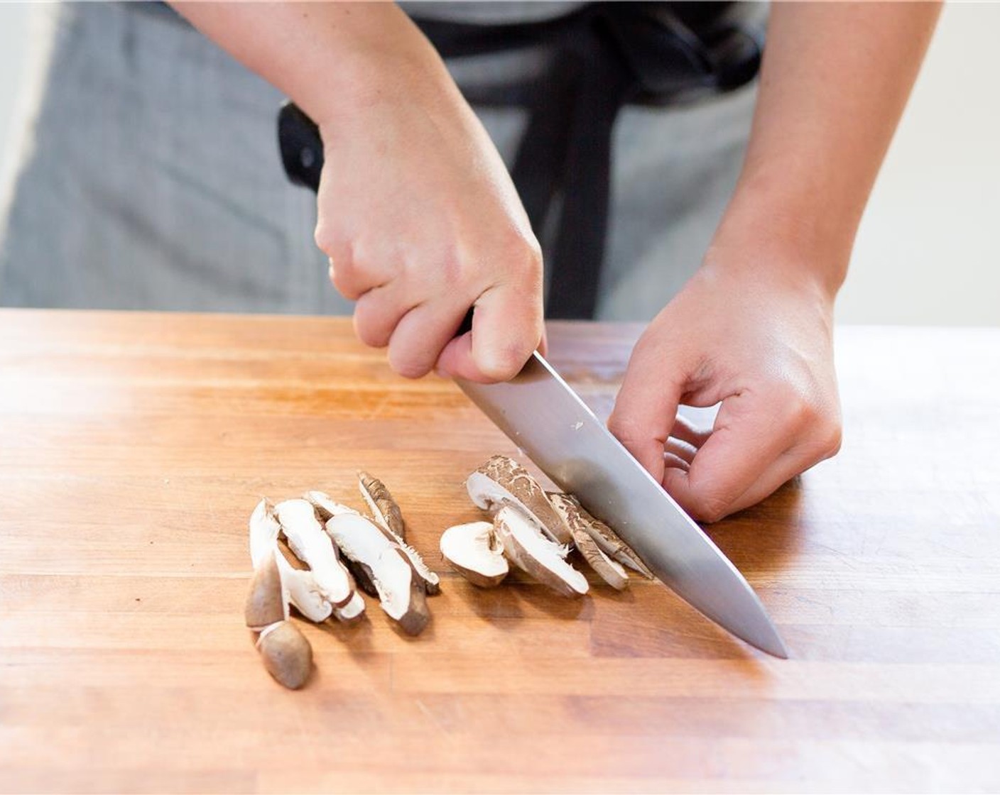 step 4 Remove the stems from the Shiitake Mushroom (1 cup) and discard stems. Cut the mushrooms into quarter inch slices, and add to bowl.