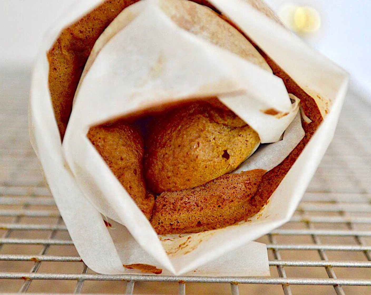 step 7 When the cake is cool and the frosting has firmed back up, gently unroll the cake and spread the frosting all over it, leaving a border for it to slightly squish out when you roll it back up. Roll it back up and remove the parchment paper as you do it.