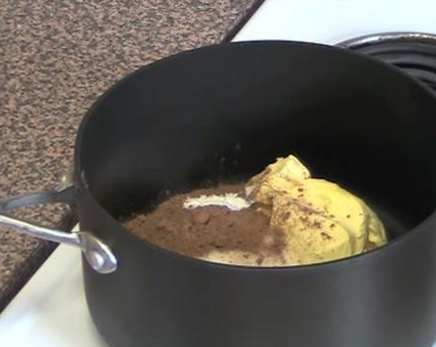 step 1 Into a saucepan under low heat, add and mix the Caster Sugar (1/2 cup), Butter (5.5 oz), Baking Soda (1/2 tsp), Unsweetened Cocoa Powder (2 Tbsp), and Water (1 cup). Turn the heat up to high, and let the mixture come to a boil.
