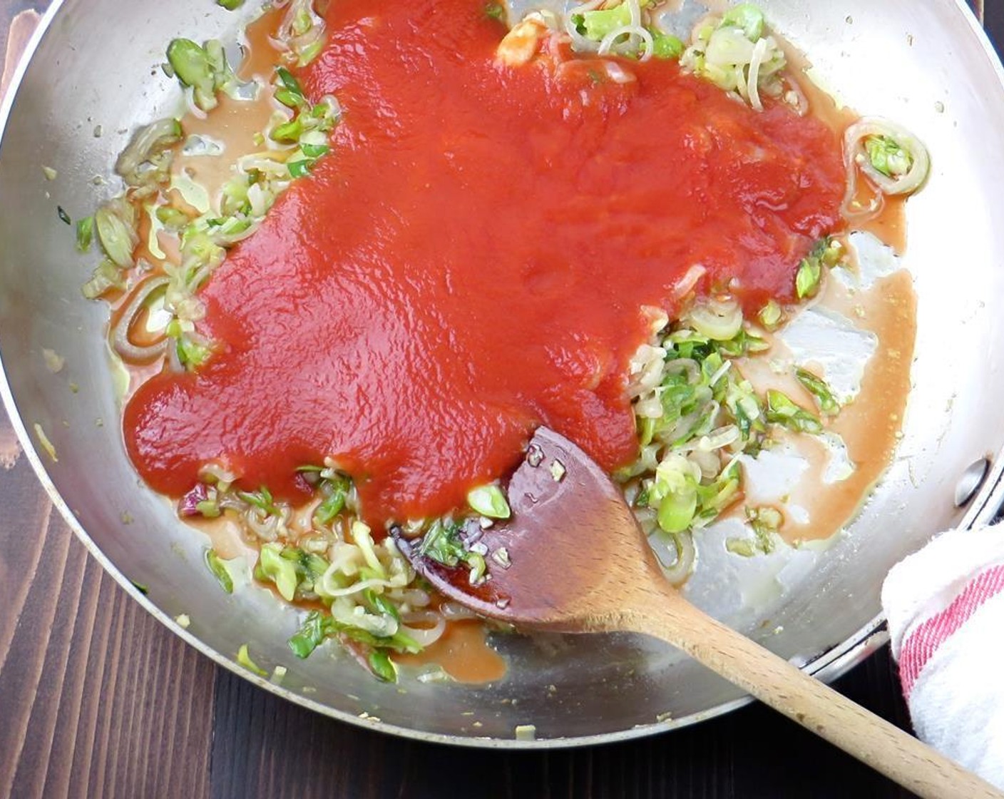 step 3 Add Tomato Sauce (1 cup), Crushed Red Pepper Flakes (1/8 tsp), Bay Leaves (2), Kosher Salt (1/2 tsp), Ground Black Pepper (to taste), and Water (1/2 cup).