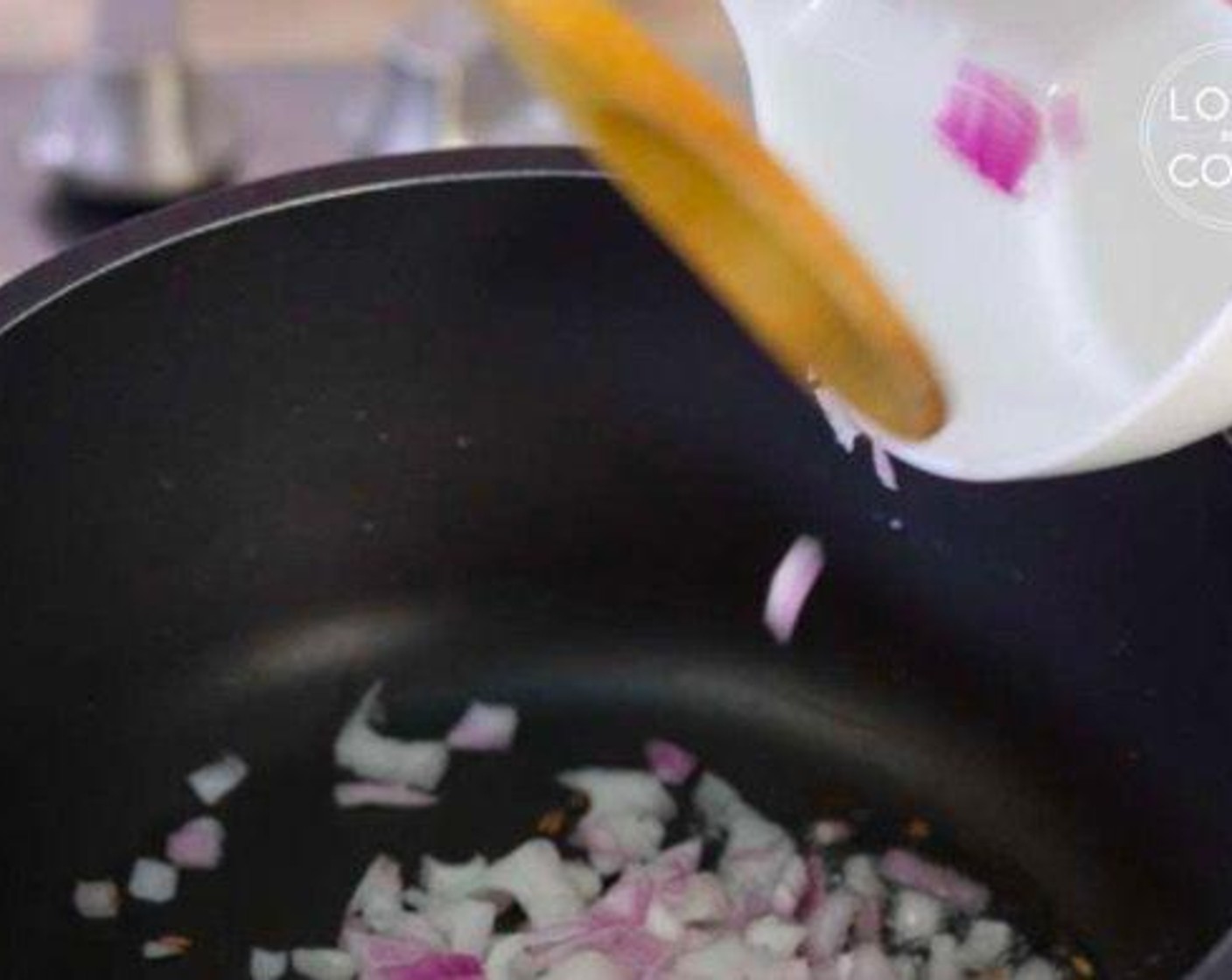 step 2 When they crackle, add Onion (1) and fry until golden brown.