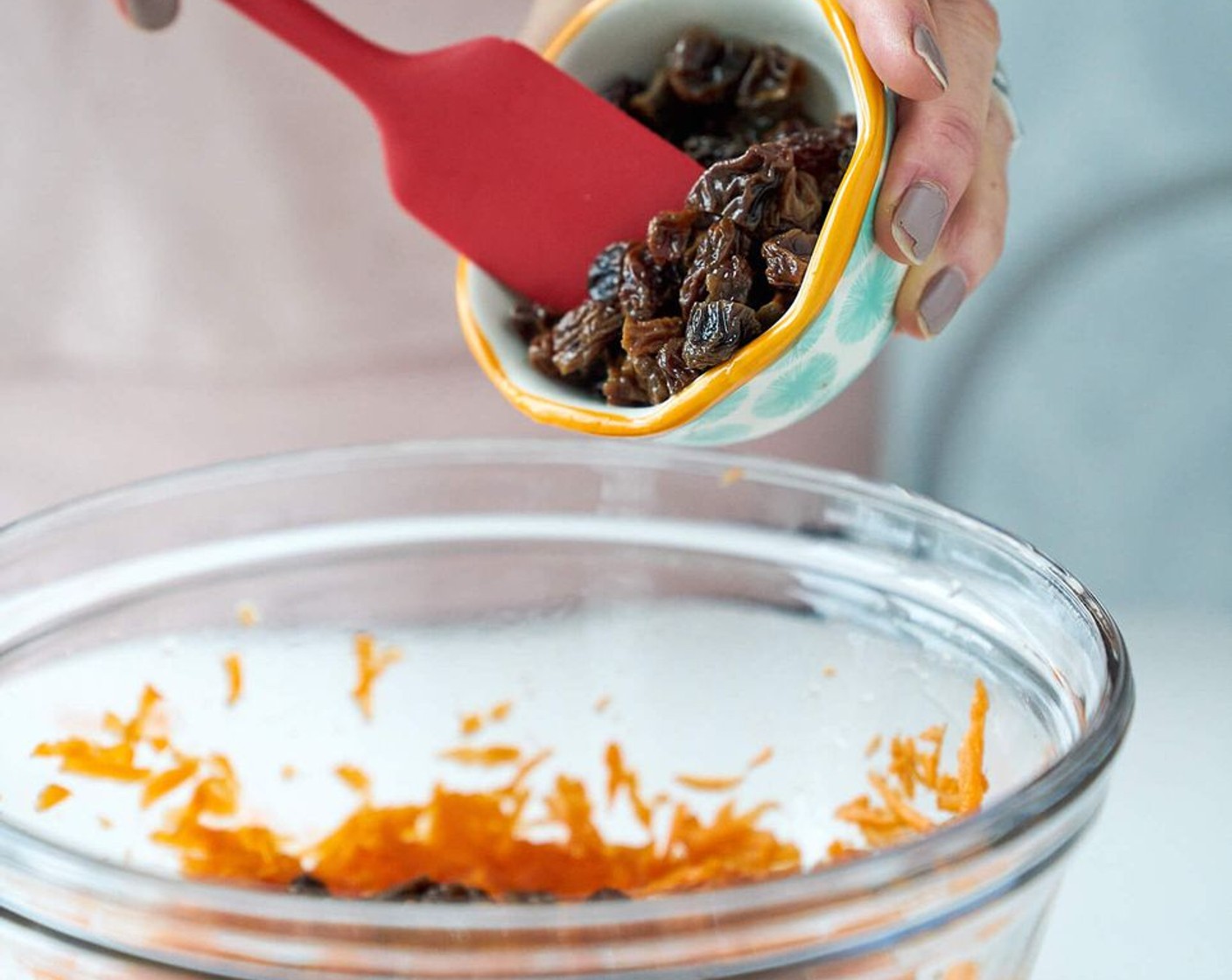 step 5 In a medium bowl, combine Carrots (1 1/2 cups), Egg (1), Dark Maple Syrup (1/2 cup), Coconut Oil (1 Tbsp) and Raisins.