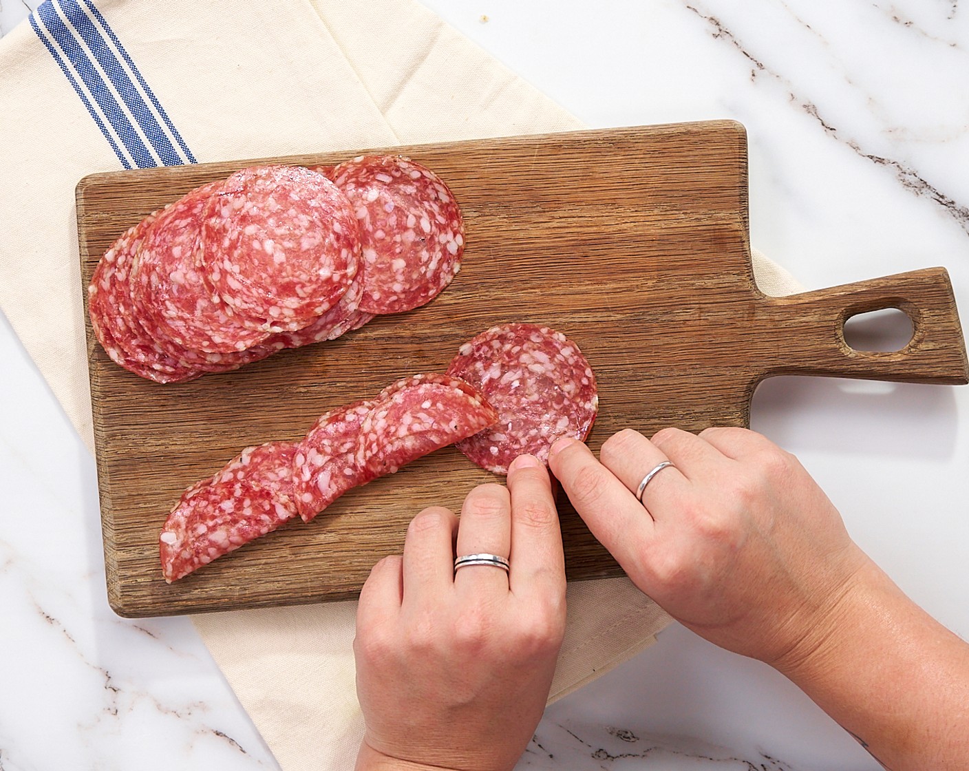 step 7 To make salami roses, start layering pieces of Salami (1 1/3 cups) folded in half.