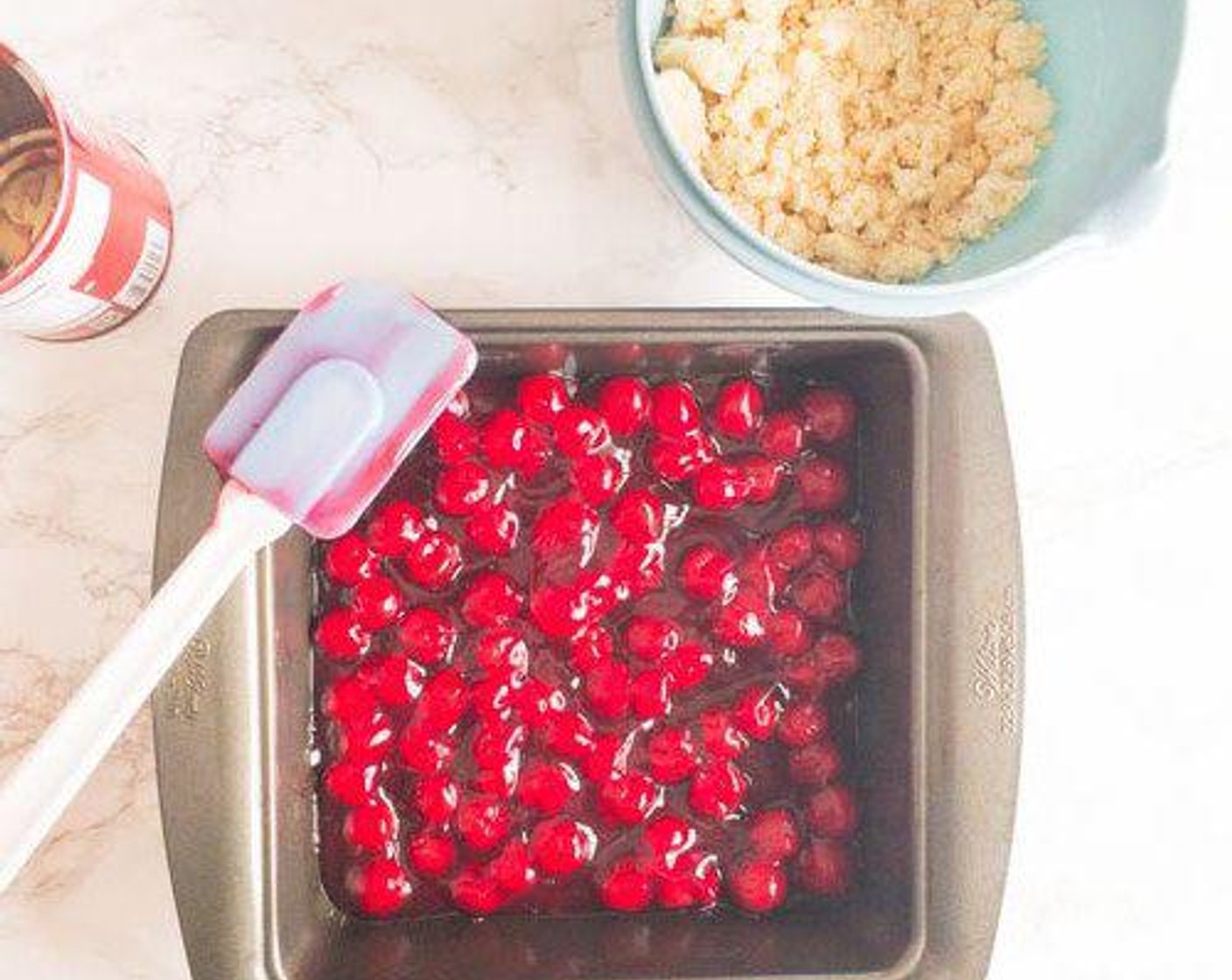 step 2 Spread Cherry Pie Filling (1 can) in a 9x9-inch baking dish.