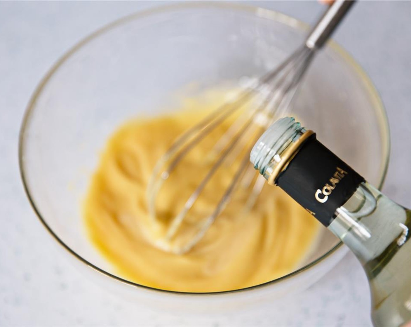 step 6 Slowly add White Wine Vinegar (2 Tbsp) to the egg mixture, whisking constantly.