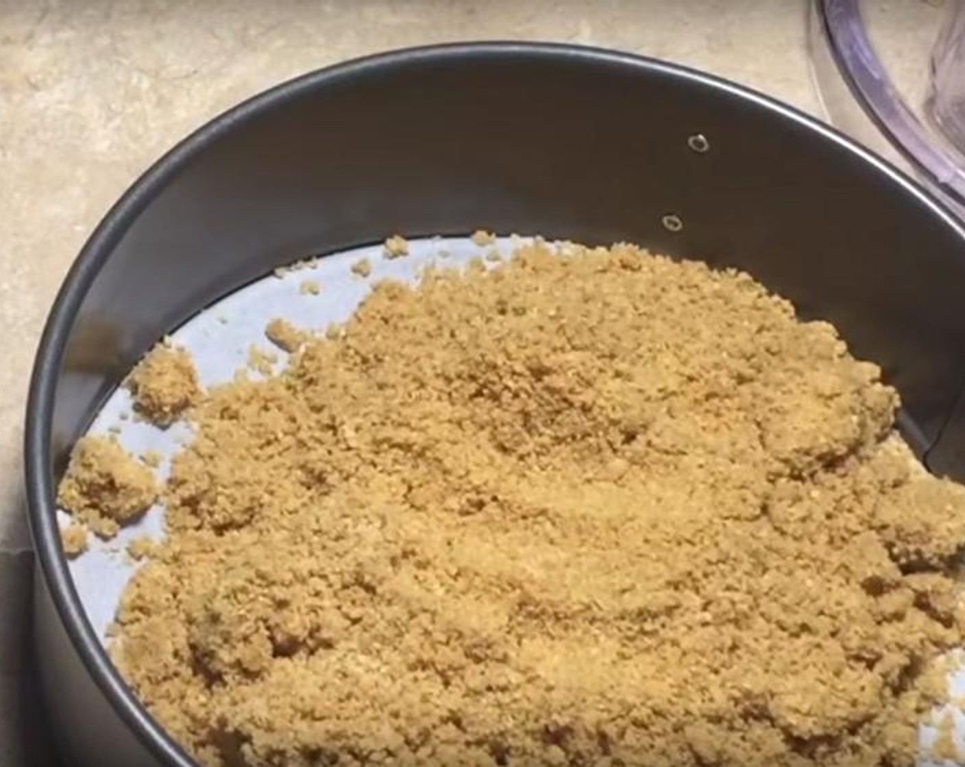 step 3 Add Butter (1/3 cup) to Graham Cracker Crumbs (2 cups) and mix them together. Put the mixture into a lined and greased spring form tin and press it down. Put it into the oven preheated to 350 degrees F (180 degrees C)  for about 7 minutes.