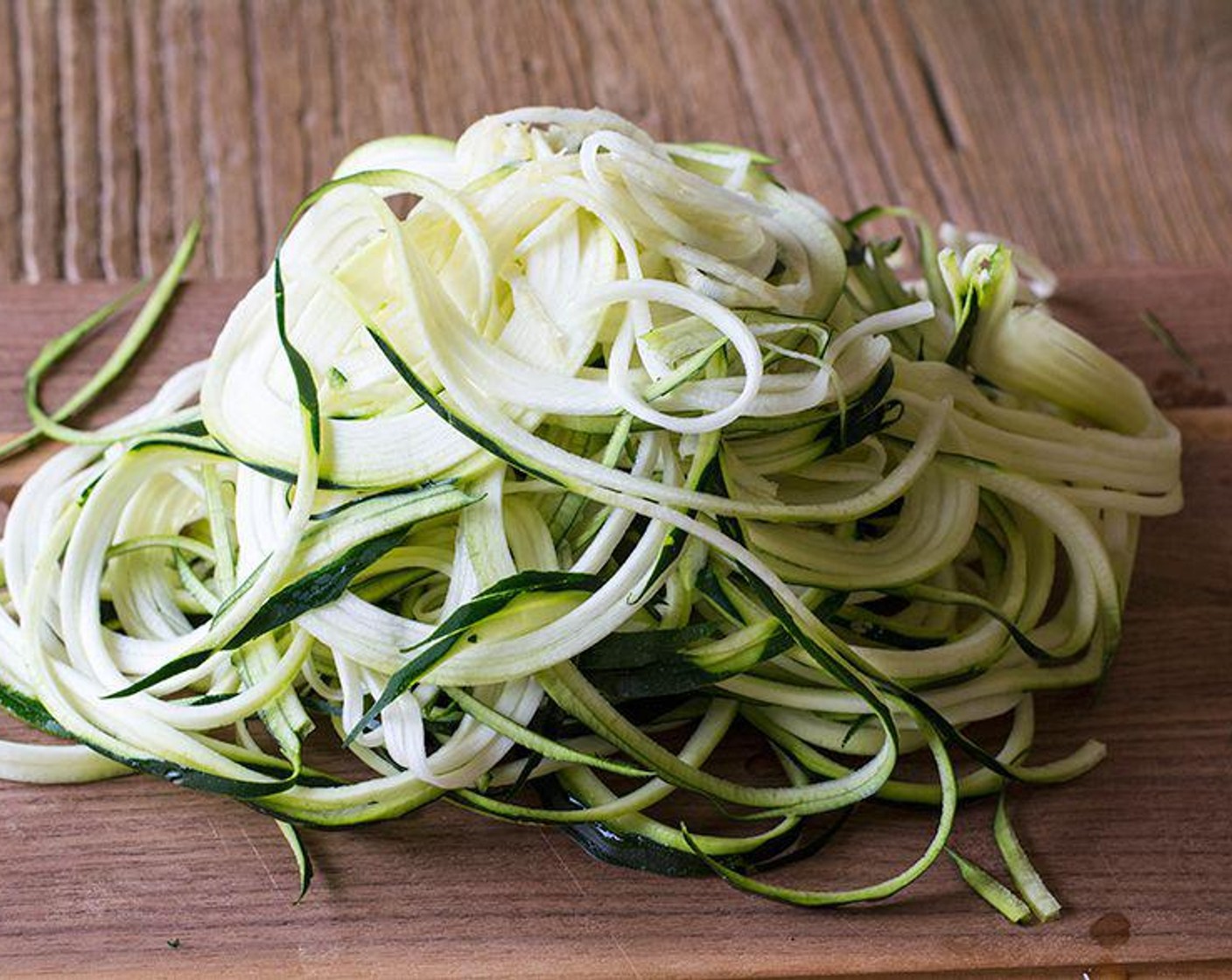 step 5 Meanwhile, place spiralized Zucchini (4) in a medium-sized frying pan greased with coconut cooking spray and cook, while stirring, for 3-4 minutes or until zucchini takes on a cooked pasta texture, sorta wilted and soft. Careful not to overcook. About mid way through cooking the zucchini, add in the Fresh Spinach (3 cups) and cook lightly until it is wilted.