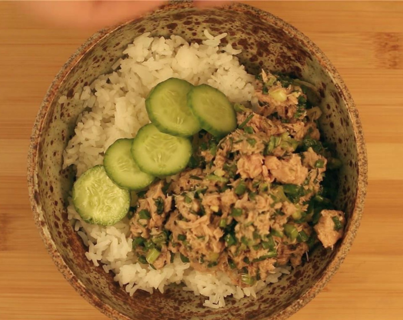 step 5 Top rice with tuna mixture and add Cucumbers (3).
