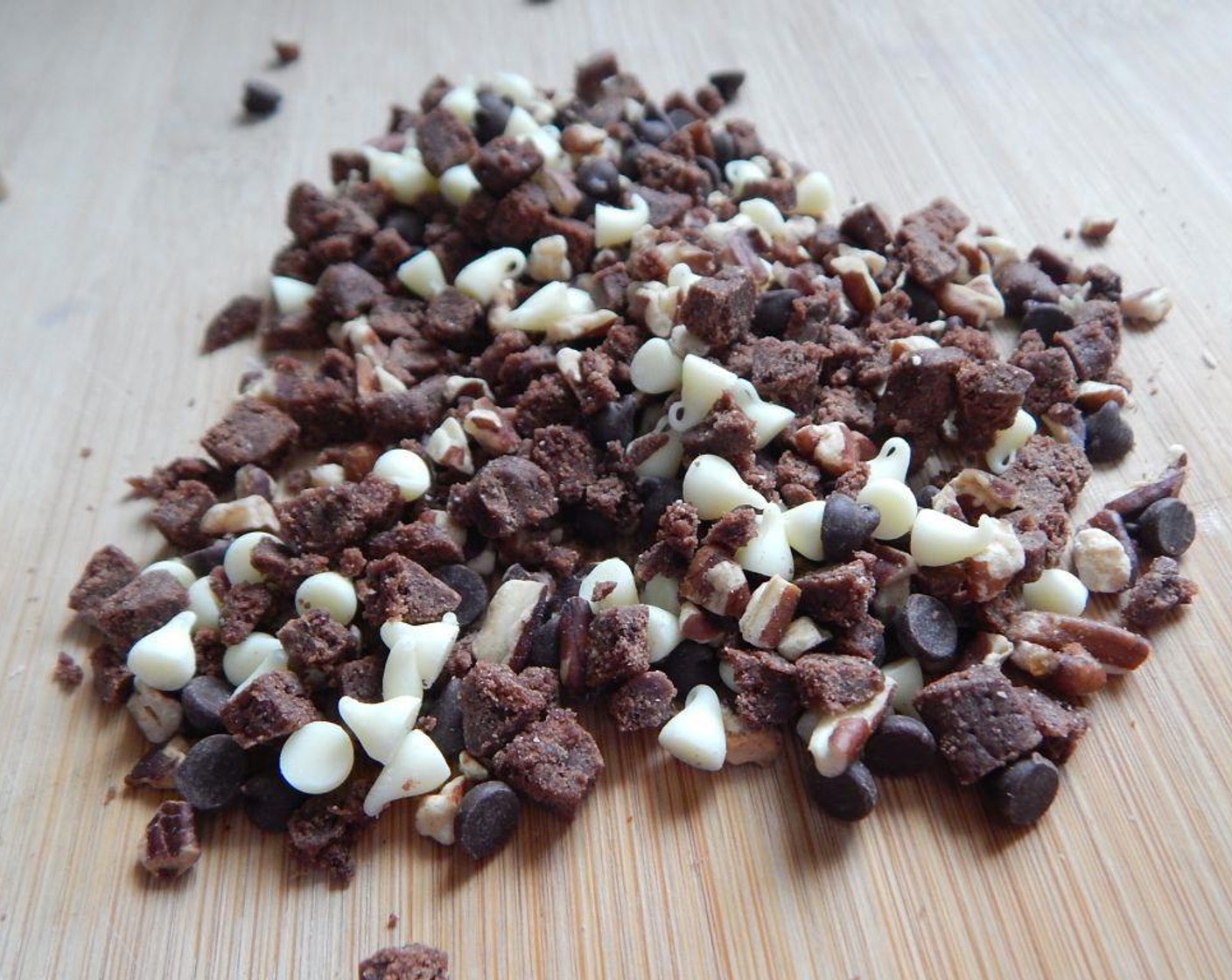 step 6 Cut up your Kellogg's Special  K® Brownie Bites (1 pckg) and mix it with Mini White Chocolate Chips (1 Tbsp), Mini Chocolate Chips (1 Tbsp) and Chopped Pecans (1 Tbsp).