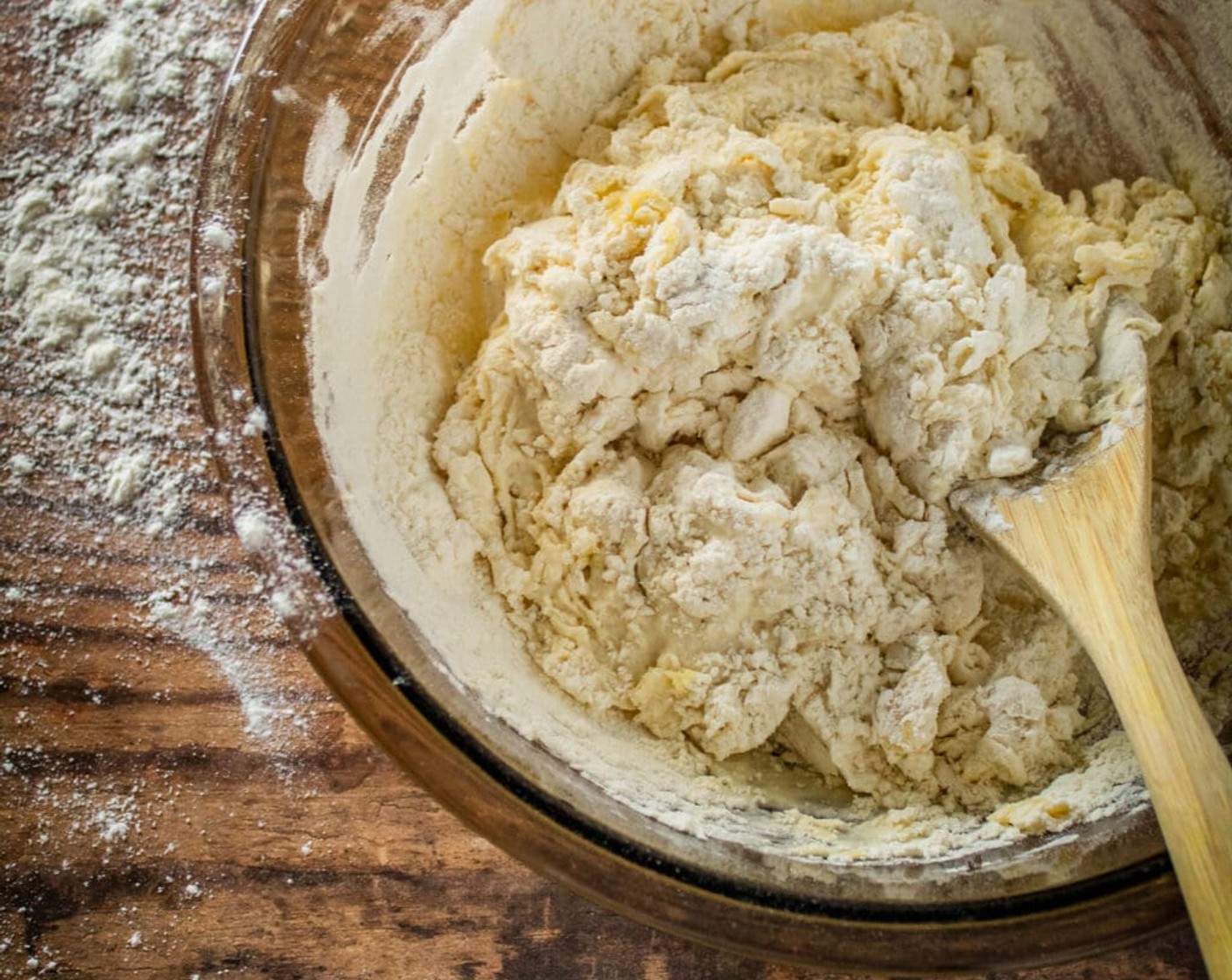 step 3 Turn dough out onto a floured surface and begin to knead, adding a little bit of flour if the dough becomes too sticky. The dough should be tacky to the touch, but not sticky.