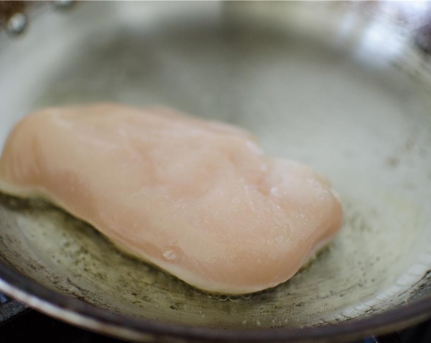 step 6 While appetizer bakes, heat olive oil in a large skillet over medium-high heat. Salt and pepper both sides of Chicken Breasts (2) breasts and cook until deep golden brown on both sides and cooked through the middle.