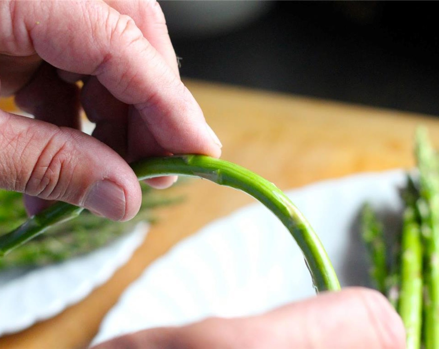 step 9 Clean Asparagus (1 bunch) and snap off woody bottom