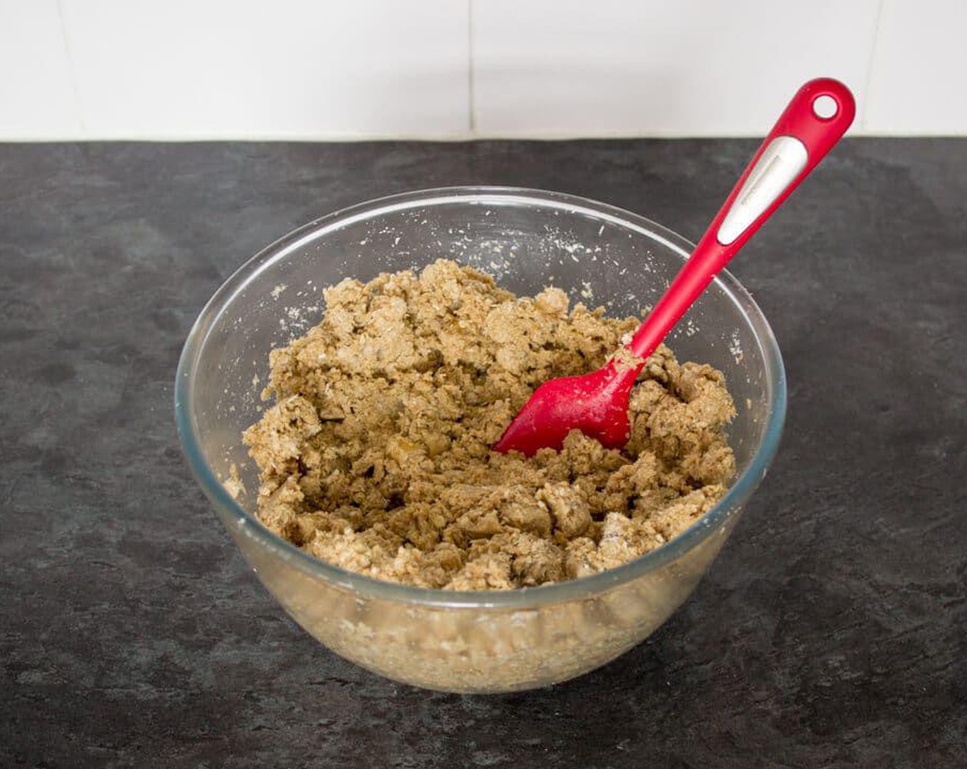 step 6 Pour the mixture into the dry ingredients and mix well with a spoon or spatula until all the oats are evenly coated and there are no dry patches left.