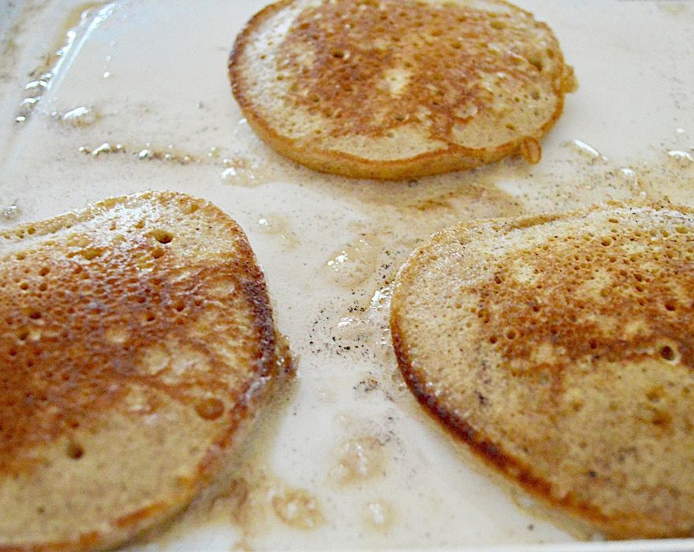 step 9 Grease the griddle with a pat of Butter (to taste) and then scoop the desired amount of batter on to make the size pancakes you want. On my griddle I easily fit 6 decent sized pancakes at a time. Cook them for about 3-4 minutes on each side, until fluffy and golden.