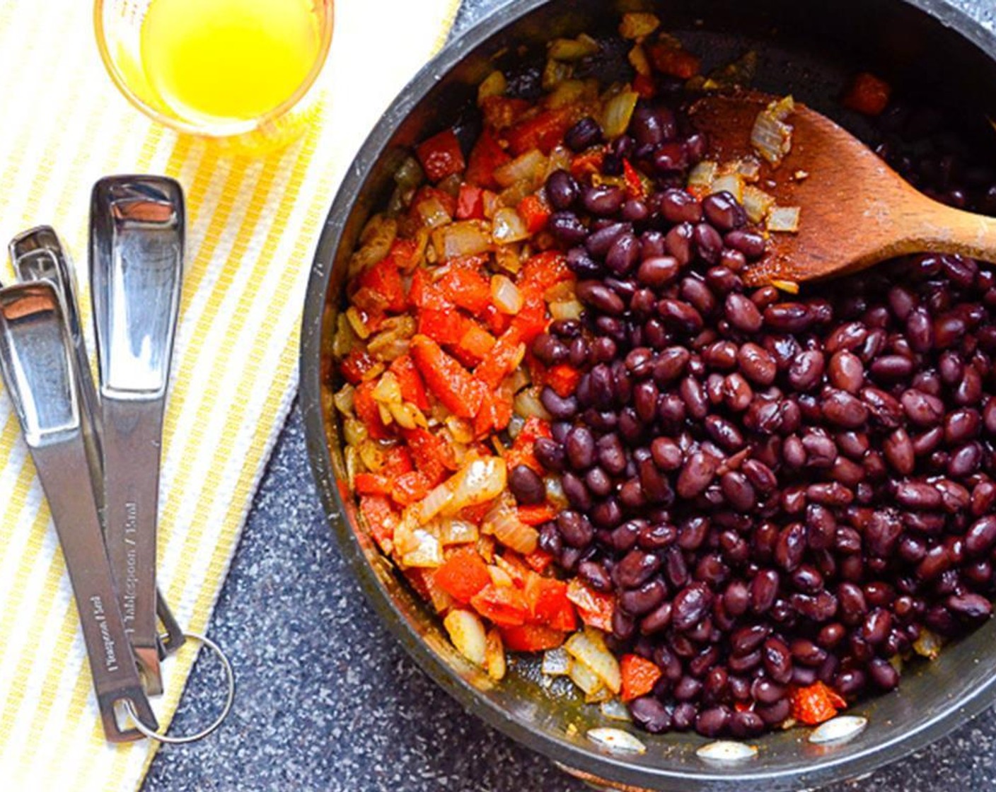 step 3 Add Canned Black Beans (1 can), Ground Cumin (1 tsp), Chipotle Chili Powder (1/2 tsp), Kosher Salt (1/4 tsp) and Ground Black Pepper (1/4 tsp). Stir to combine. Add the Chicken Broth (1/4 cup). Cook over medium heat for 3 to 4 minutes until most of the liquid is evaporated.