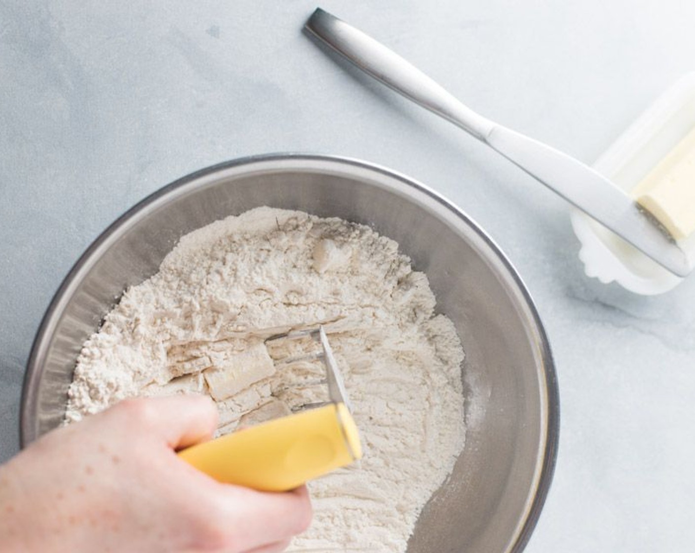 step 2 Add Butter (1 Tbsp) and cut into flour with a pastry knife until well incorporated.