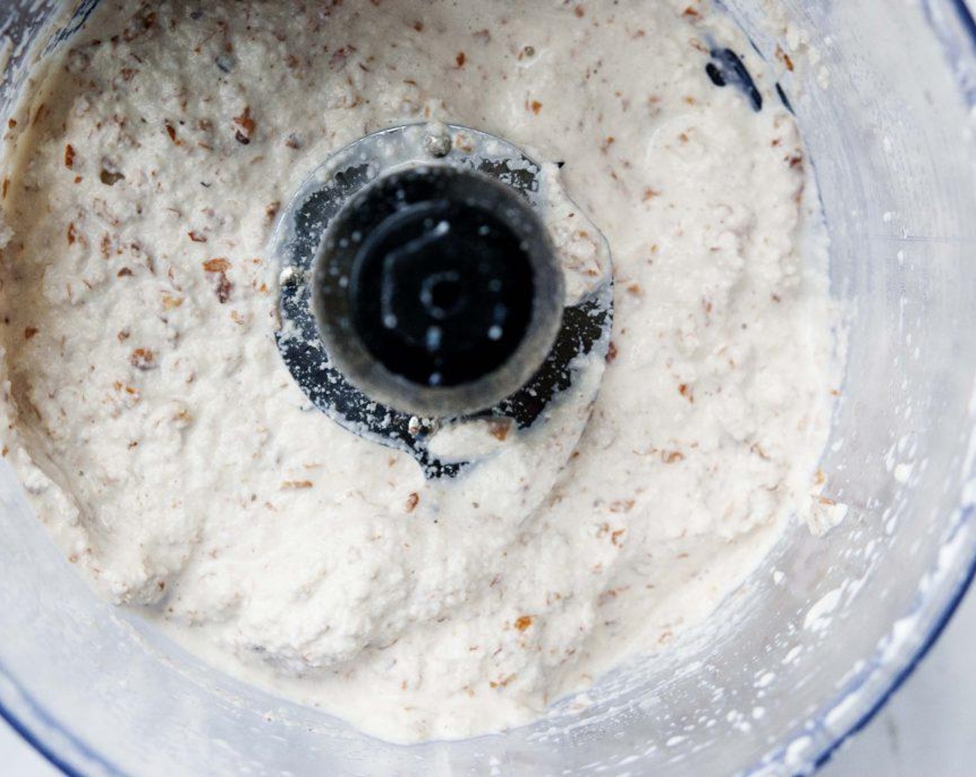 step 3 Peel the almonds. Place the almonds with the liquid and Salt (1 pinch) into a food processor and blend until smooth.