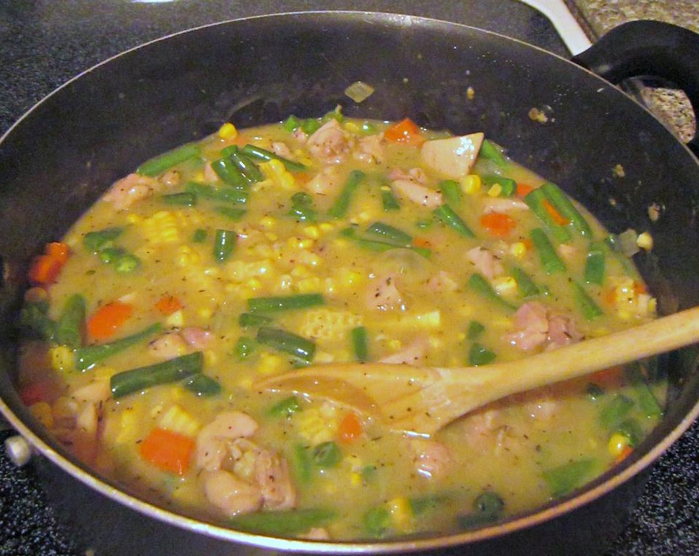 step 8 Back to the stew. Once your chicken is cooked, add the Green Beans (2 cups) and Frozen Sweet Corn (1/2 cup) to the pot and adjust Salt (to taste) and Ground Black Pepper (to taste).