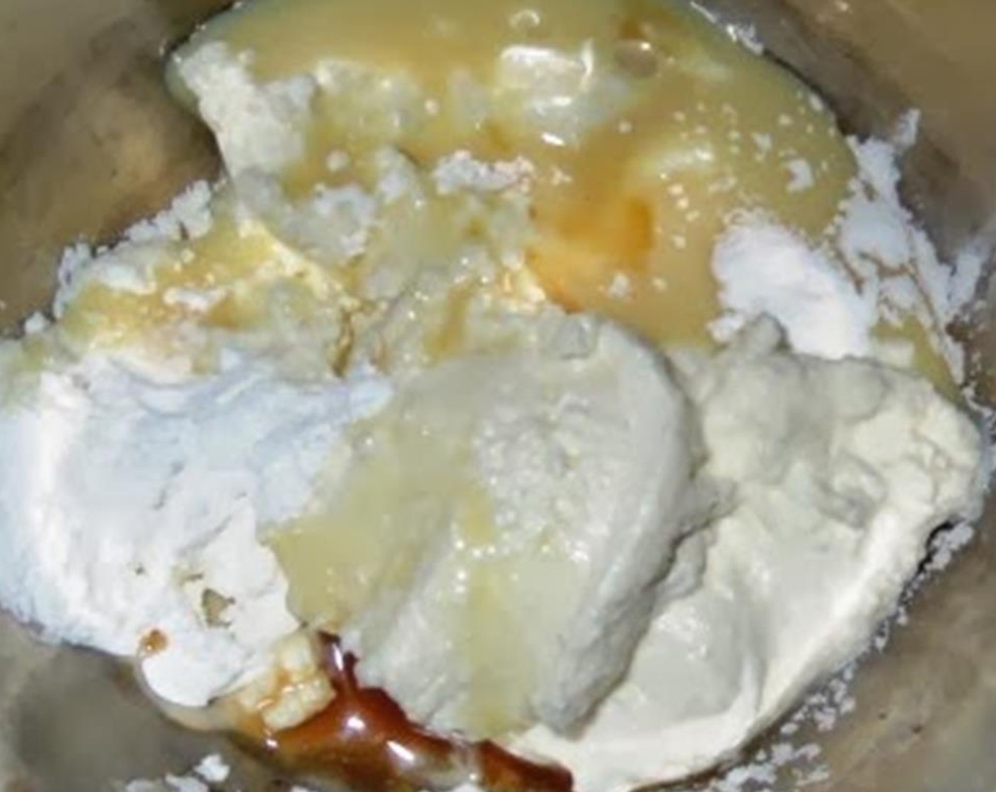 step 4 In another bowl add Cream Cheese (4 Tbsp), Sweetened Condensed Milk (4 Tbsp), Corn Starch (1 Tbsp), the remaining Vanilla Extract (1 tsp), and Salt (1 pinch). Mix well.
