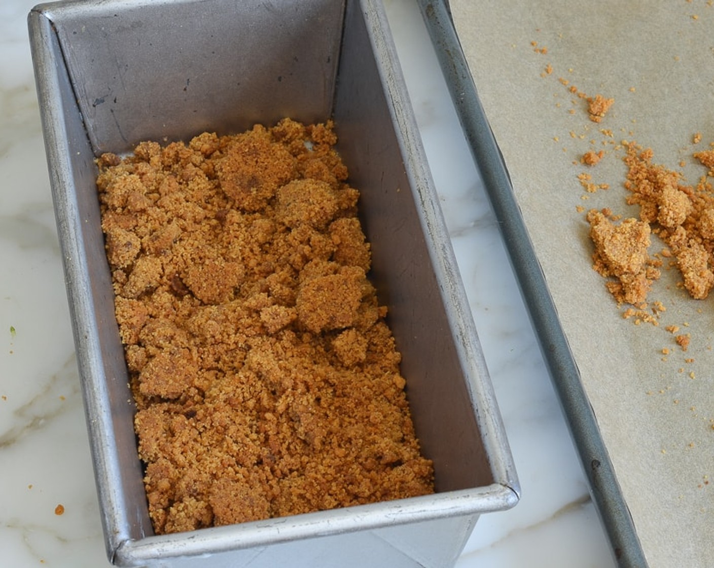 step 9 Arrange half of the crust evenly over the bottom of an 8-by-4-inch loaf pan.