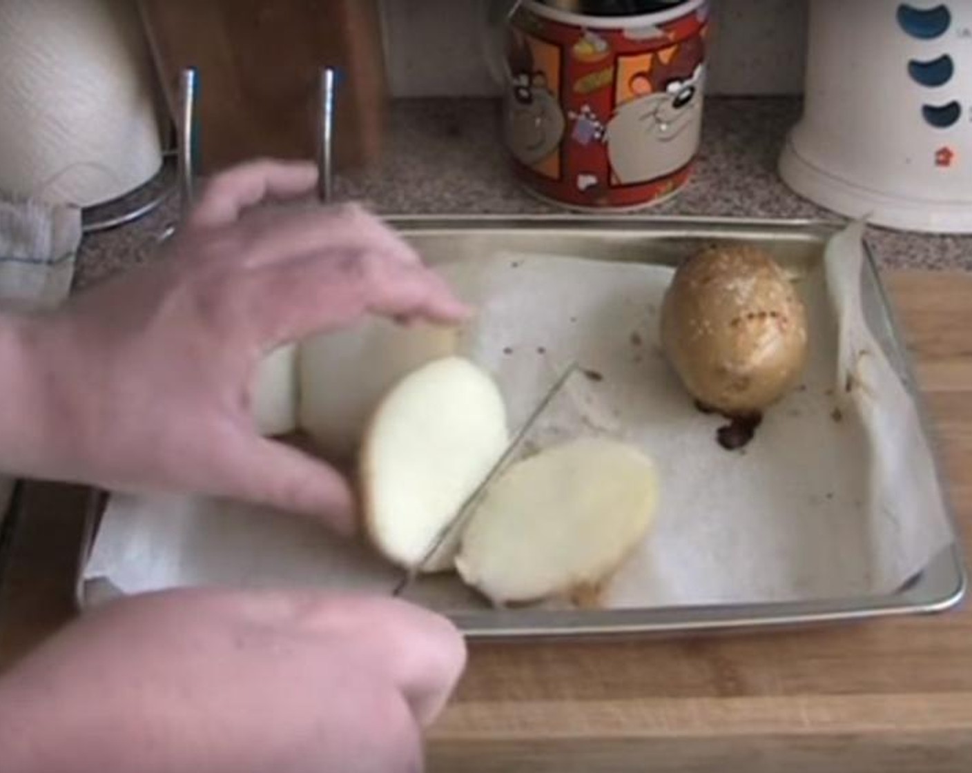step 2 Cut the baked potatoes in half lengthwise. Using the spoon, scoop out the insides into a bowl.