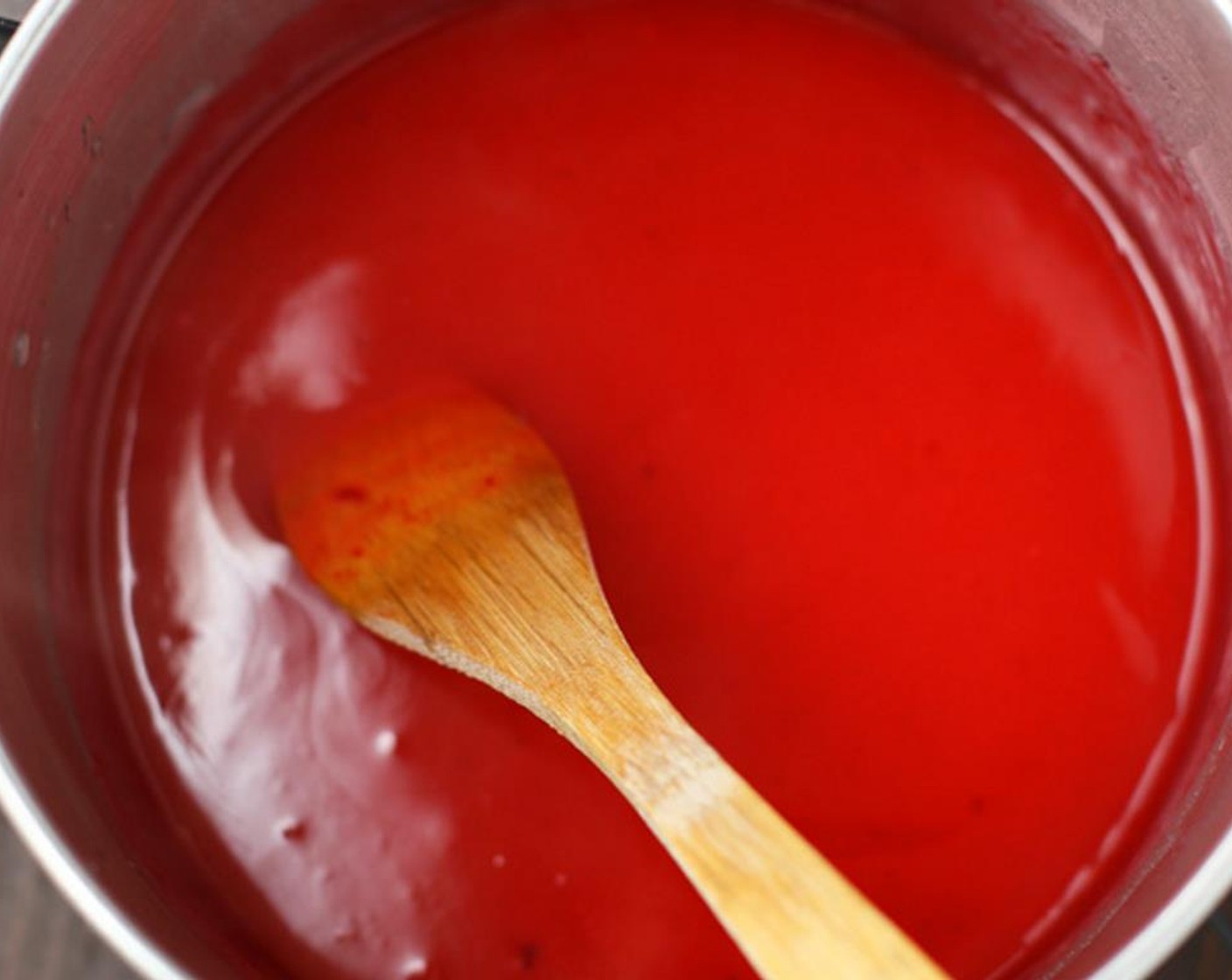 step 10 Remove from heat and stir in Strawberry Gelatin (3 1/2 Tbsp). Stir until completely dissolved.