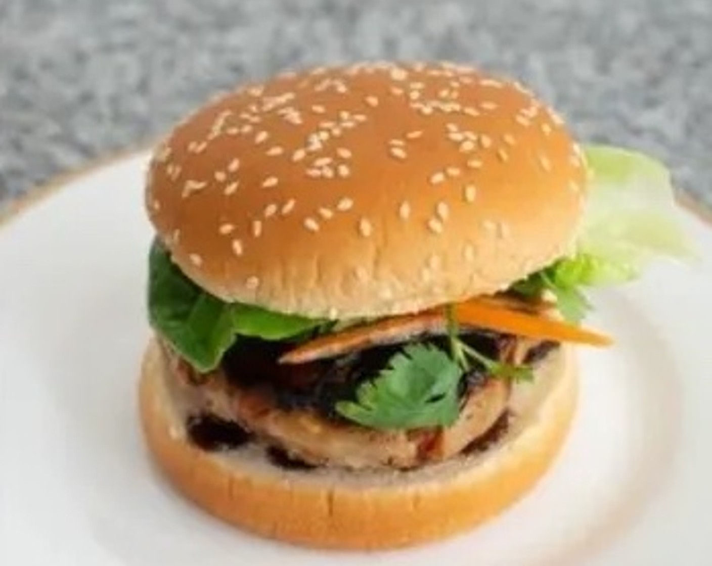 step 7 Assemble the burger in this sequence: place the burger patty on the bottom of each Hamburger Buns (4), smear the sauce over the patty, top with Carrot (1/2 cup), Fresh Cilantro Leaf (1/2 cup), and Lettuce Leaves (as needed), last top with the burger bun.