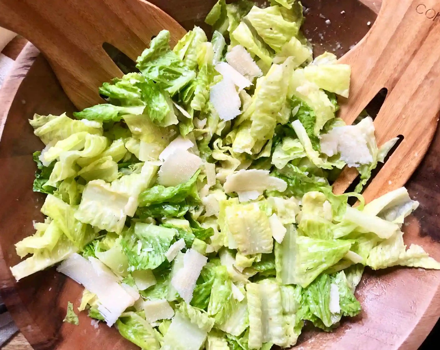 step 6 Divide the lettuce into 4 plates. Garnish with shaved Parmesan and, if desired, additional anchovies.