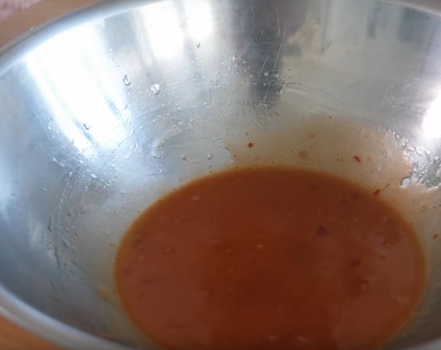 step 2 In a large mixing bowl, whisk together Extra-Virgin Olive Oil (2 Tbsp), Sweet Chili Sauce (3 Tbsp), Sriracha (1 Tbsp), and juice from the Lime (1).