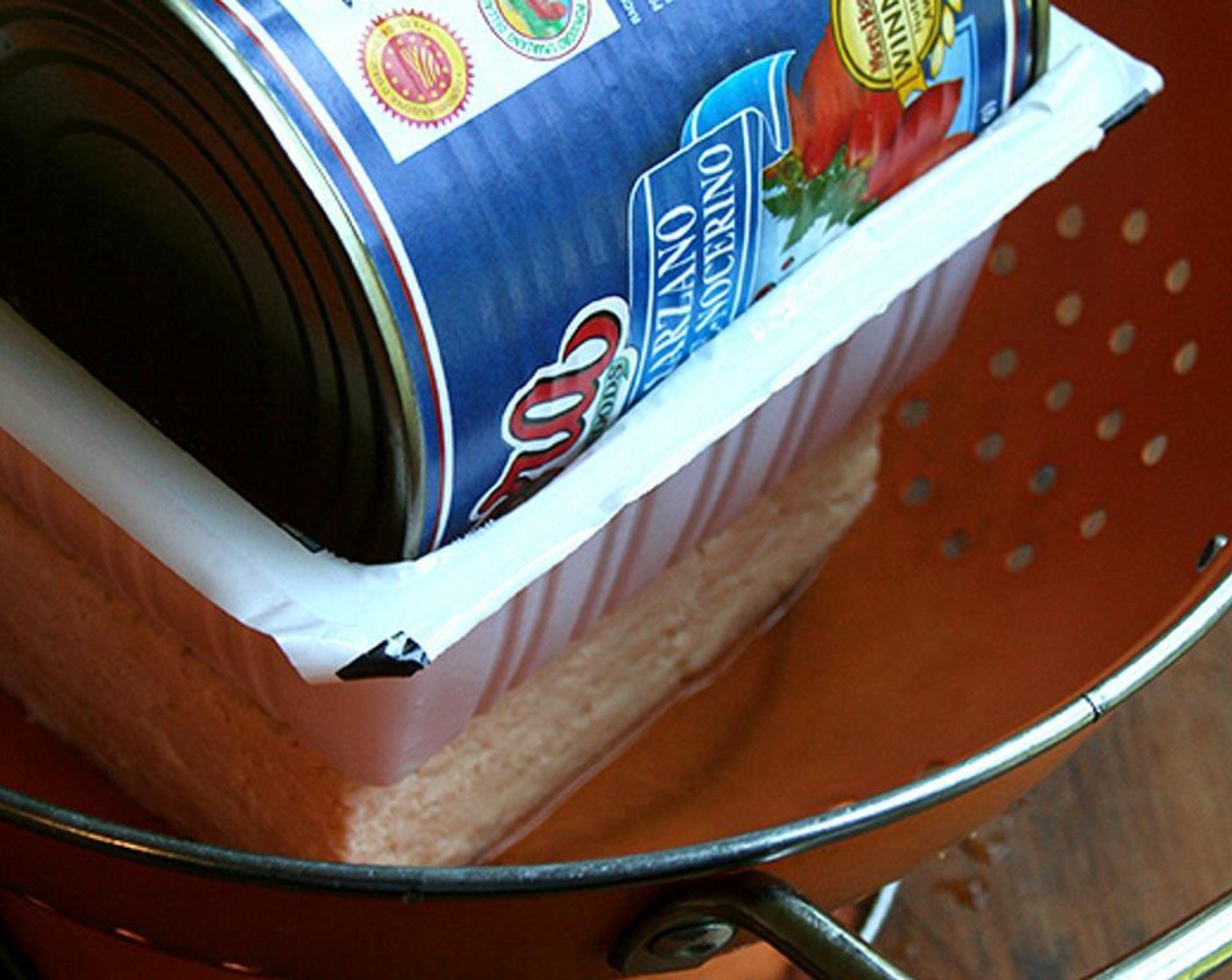 step 3 To marinate the Firm Tofu (14 oz) , drain it for as much time as possible -- at least 30 minutes. Place block of tofu in a colander. Place the package (or some other similar-sized vessel) on top and weigh down with a can of tomatoes or something similar.