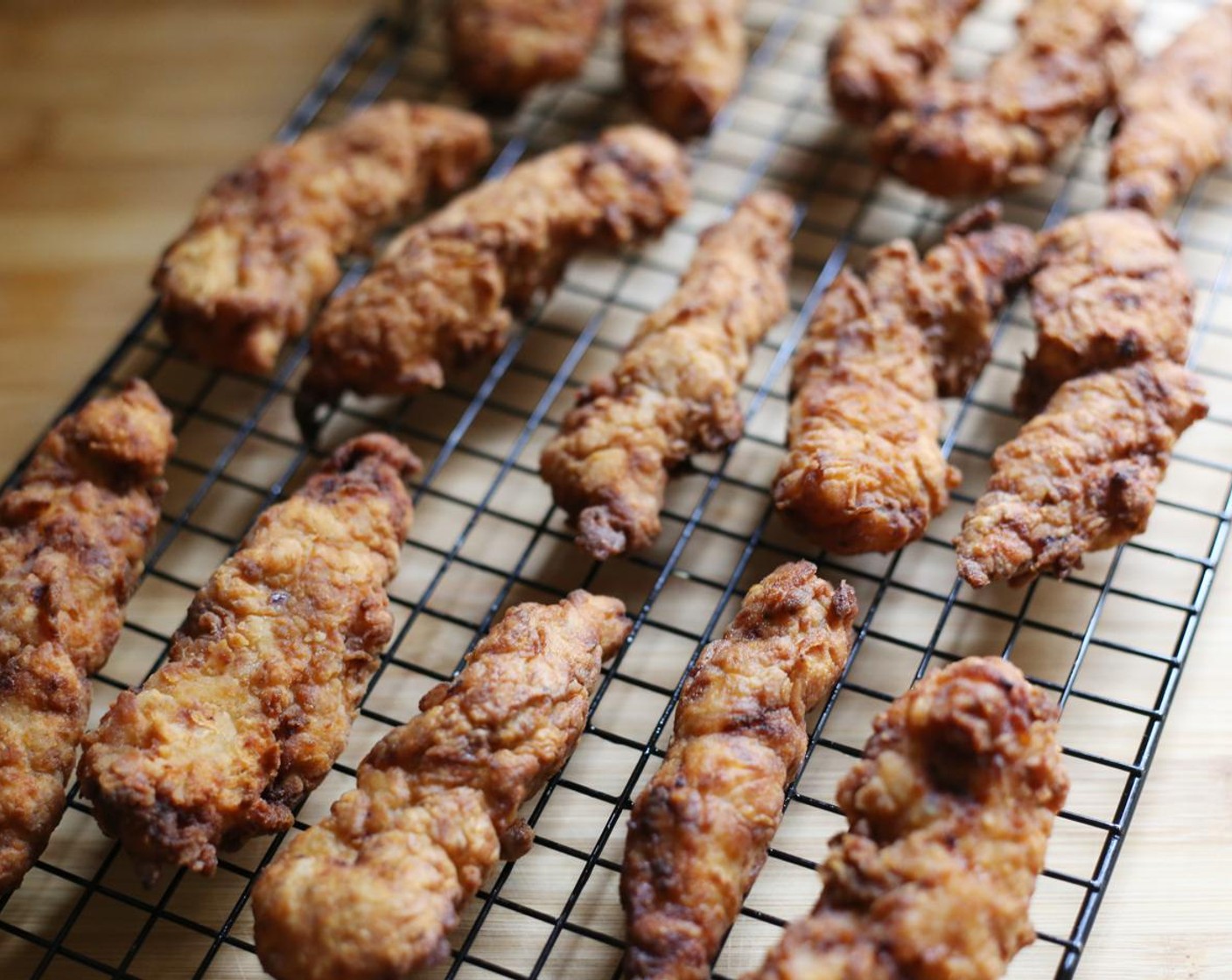 step 12 Remove from the oil and allow to drain on a cooling wire. Repeat until all the tenderloins are cooked.