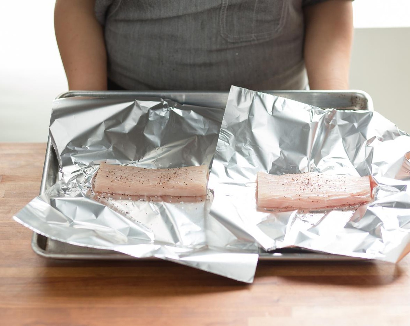 step 7 Pat dry the Mahi-Mahi Fillets (2) with paper towels. Prepare two square sheets of aluminum foil by laying them flat on a work surface.
