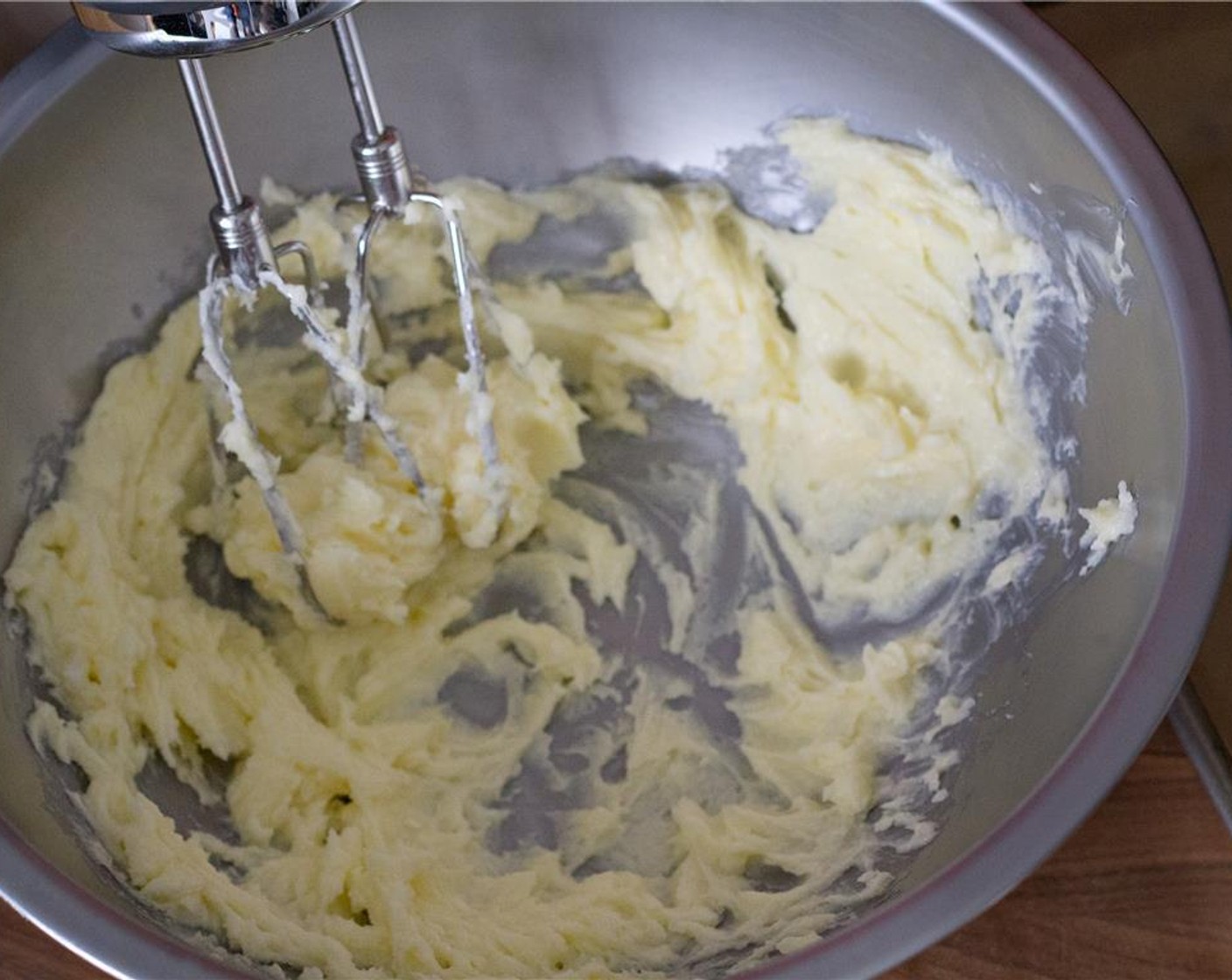 step 3 In another medium bowl, beat together the Unsalted Butter (1 cup) and Rose Water (1/2 Tbsp) for about a minute, until smooth and creamy.