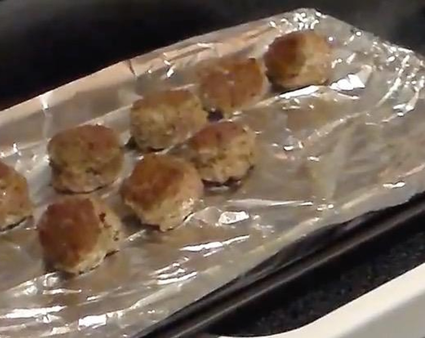 step 6 Place the meatballs on a foil-covered baking sheet.