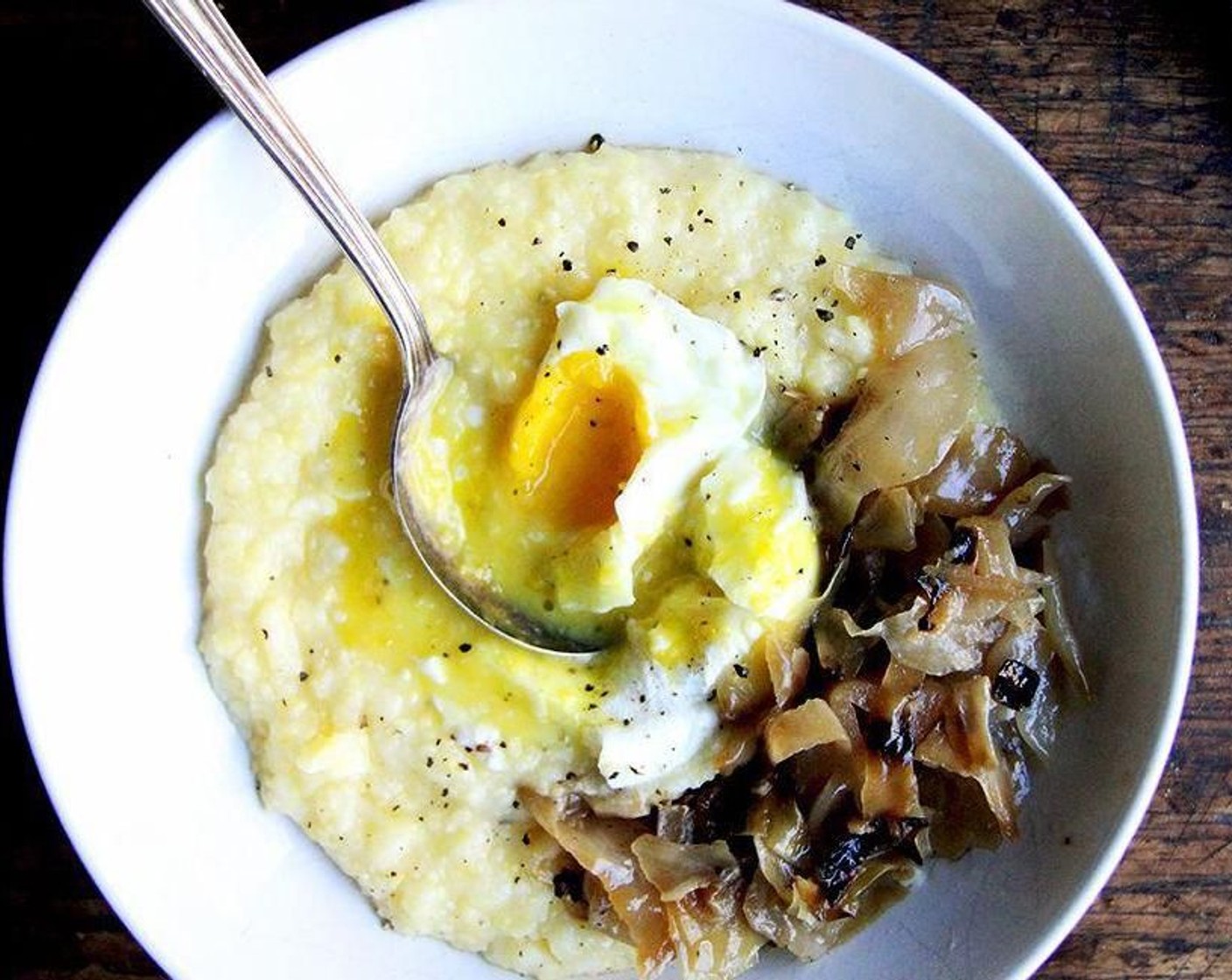 step 4 To serve: Spoon polenta into bowls. Top with shavings of Shaved Parmesan Cheese (to taste) if desired, and top each mound of polenta with a poached egg. Season with a pinch of Sea Salt (to taste) and Ground Black Pepper (to taste) to taste. Drizzle with Truffle Oil (to taste), if desired. Serve with mushrooms or greens on the side, if desired.