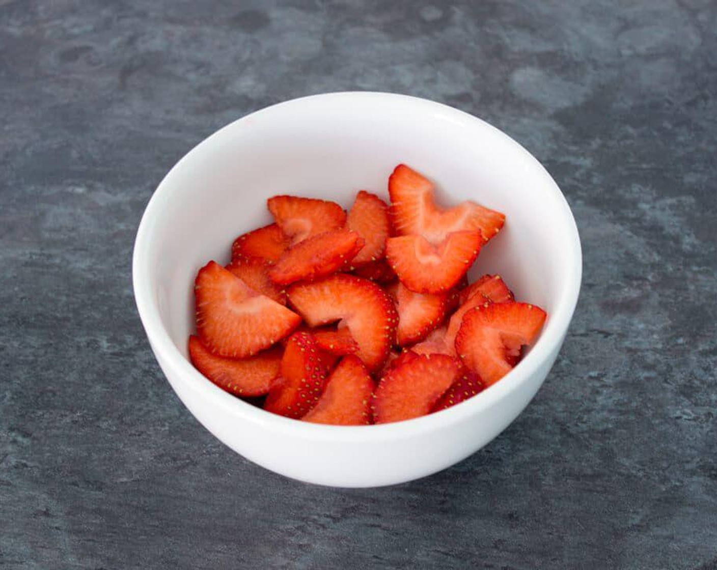 step 3 Once your batter is chilled, get the fillings ready. Hull and slice the Fresh Strawberries (to taste).