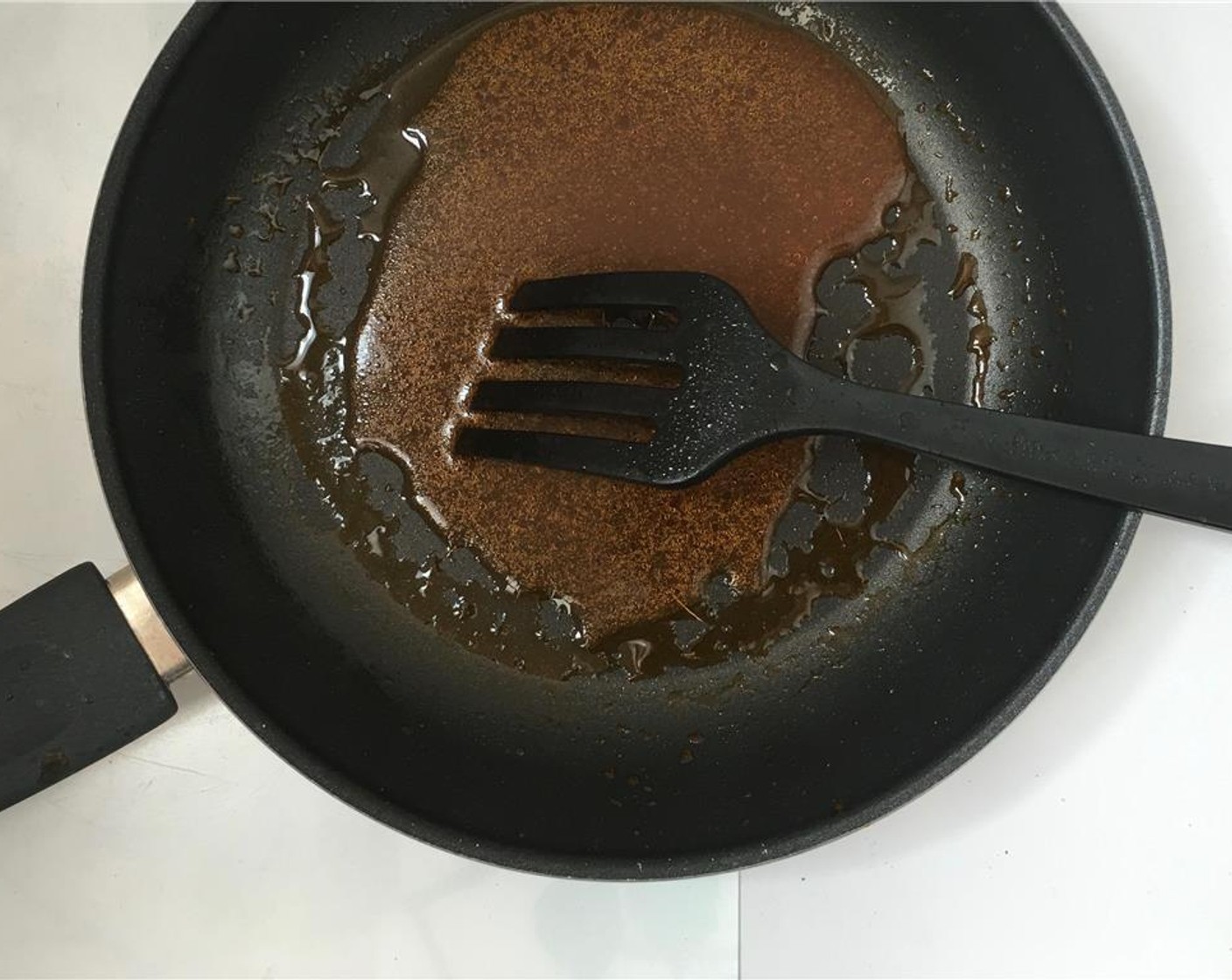 step 4 Place the pan over high heat. Once the paste starts to sizzle, add 3 tablespoons of water.