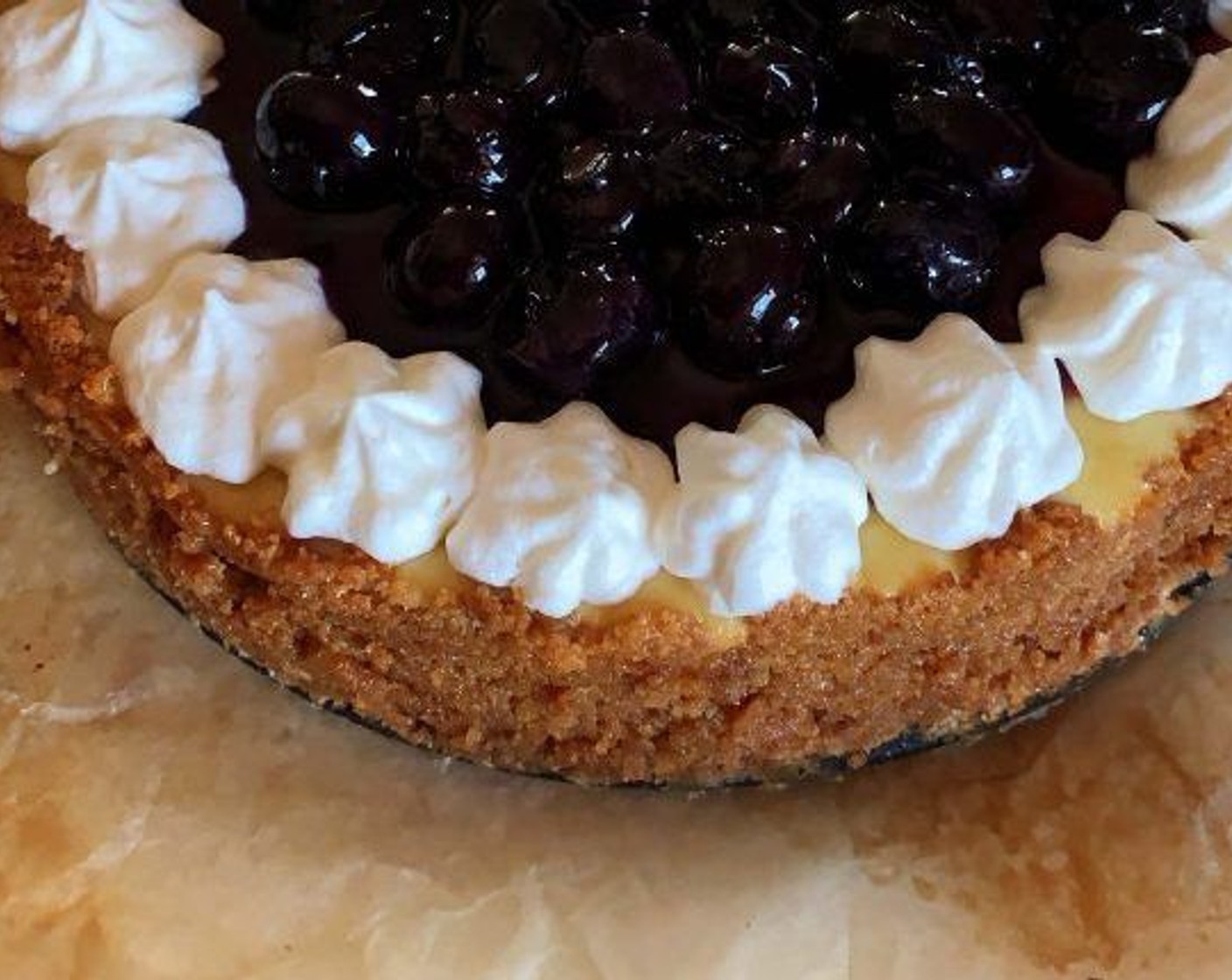 step 8 Pour the blueberries in the center of the cheesecake and decorate the edges with Whipped Cream (to taste), if desired. Keep refrigerated until ready to serve.