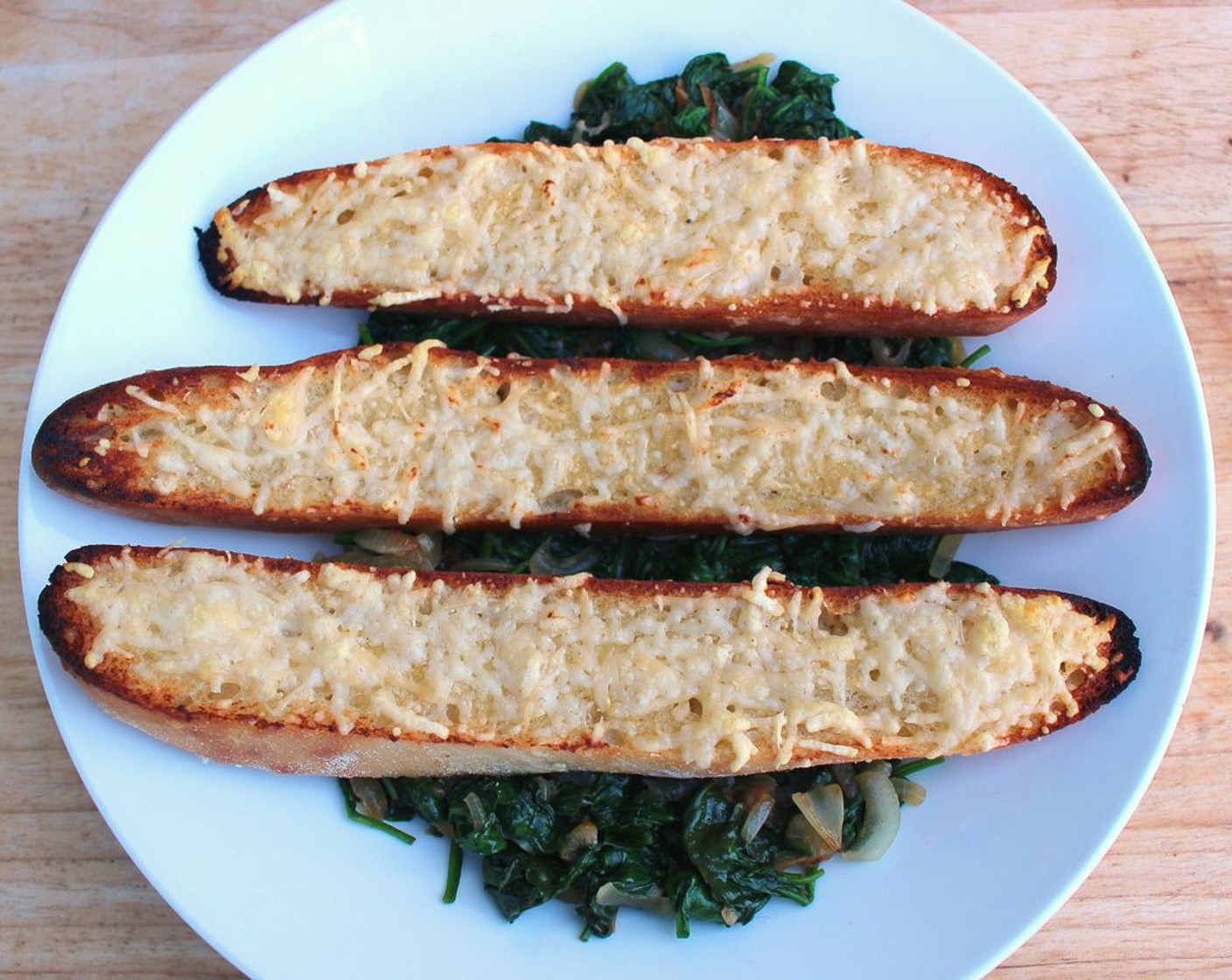 step 11 Plate the bread on top of the spinach.