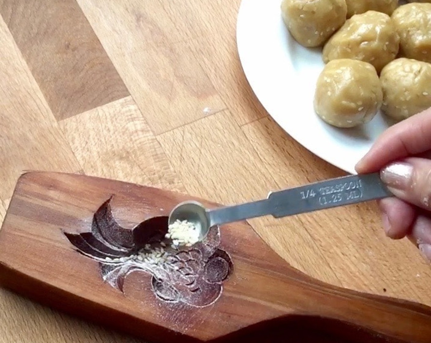 step 13 Lightly dust a mooncake mold and sprinkle with sesame seeds.