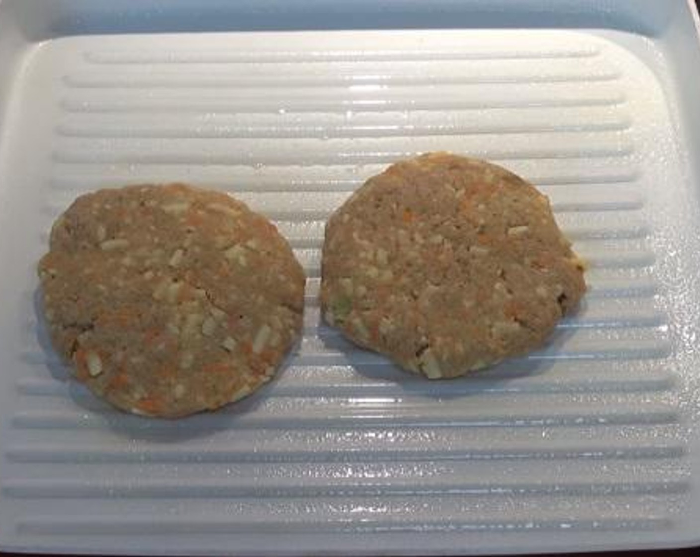 step 3 On a greased grill pan, cook each patty for 8 minutes on each side.