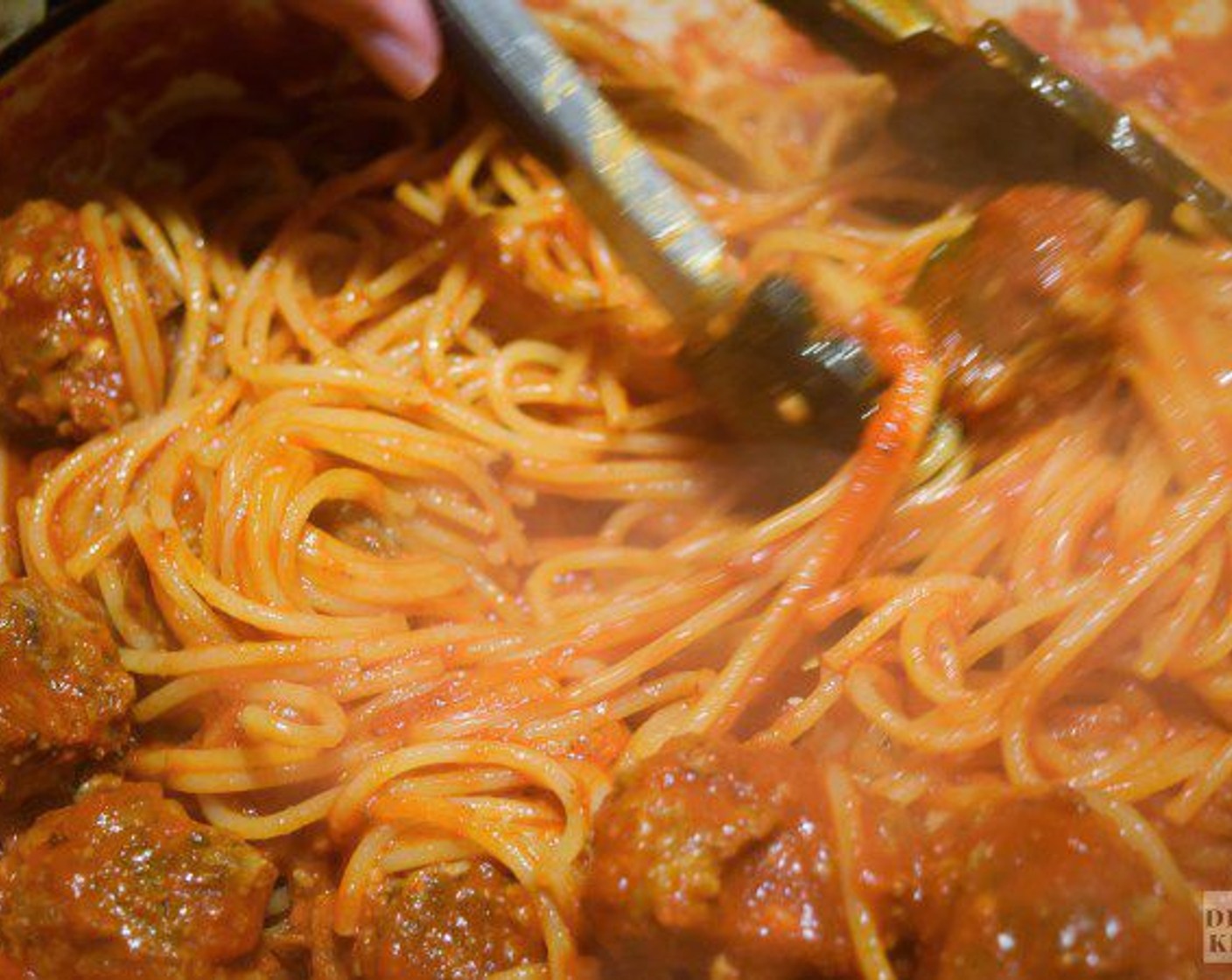 step 11 Stir the pasta and pasta water into the sauce and meatballs, keeping the heat on low, and cook for about 2 minute until the sauce and pasta have married.