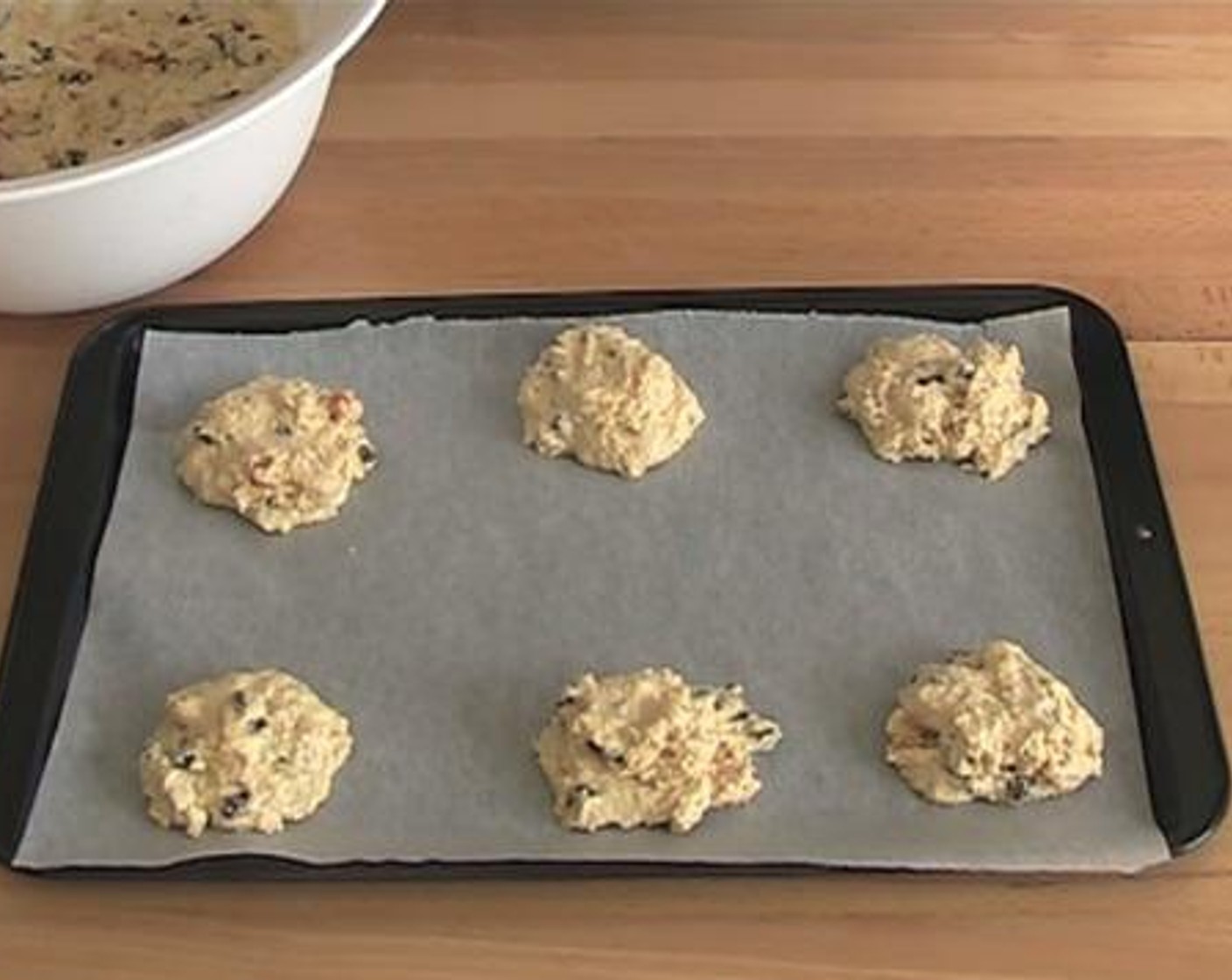 step 4 Take roughly tablespoons of the dough, and put them onto an oven tray lined with baking paper. Make sure to have a good spacing between them. Bake inside a preheated oven under 200 degrees C (400 degrees F) for about 15 minutes.