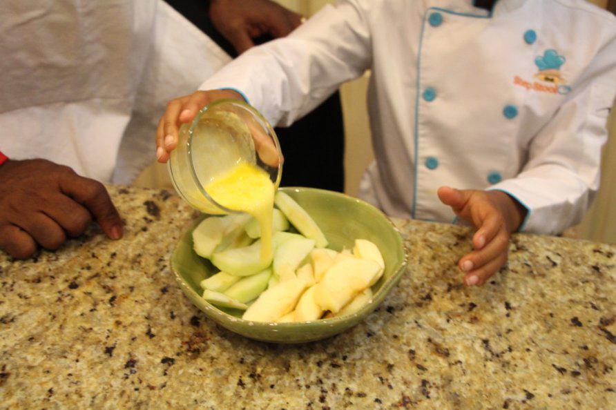 Step 3 of Apple Pie Bites Recipe: Pour 1 tablespoon of Butter (1 tablespoon) over the apple slices in a bowl.