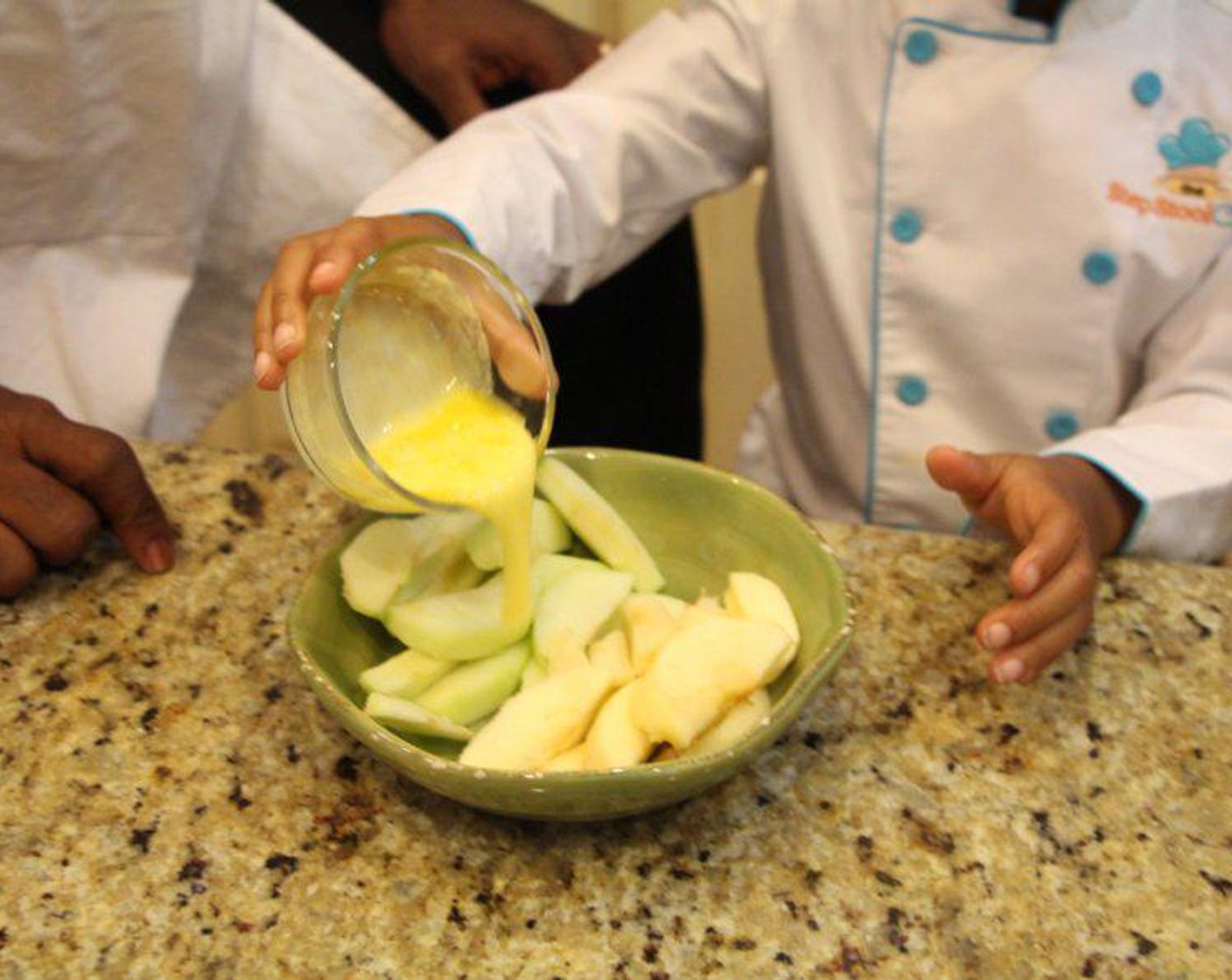 step 3 Pour 1 tablespoon of Butter (1 Tbsp) over the apple slices in a bowl.